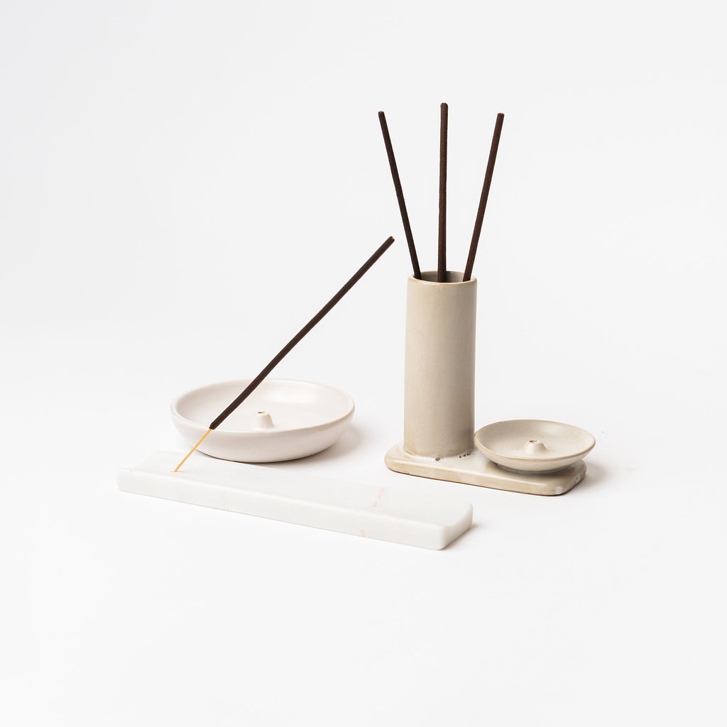 Various white  incense holders on a white background