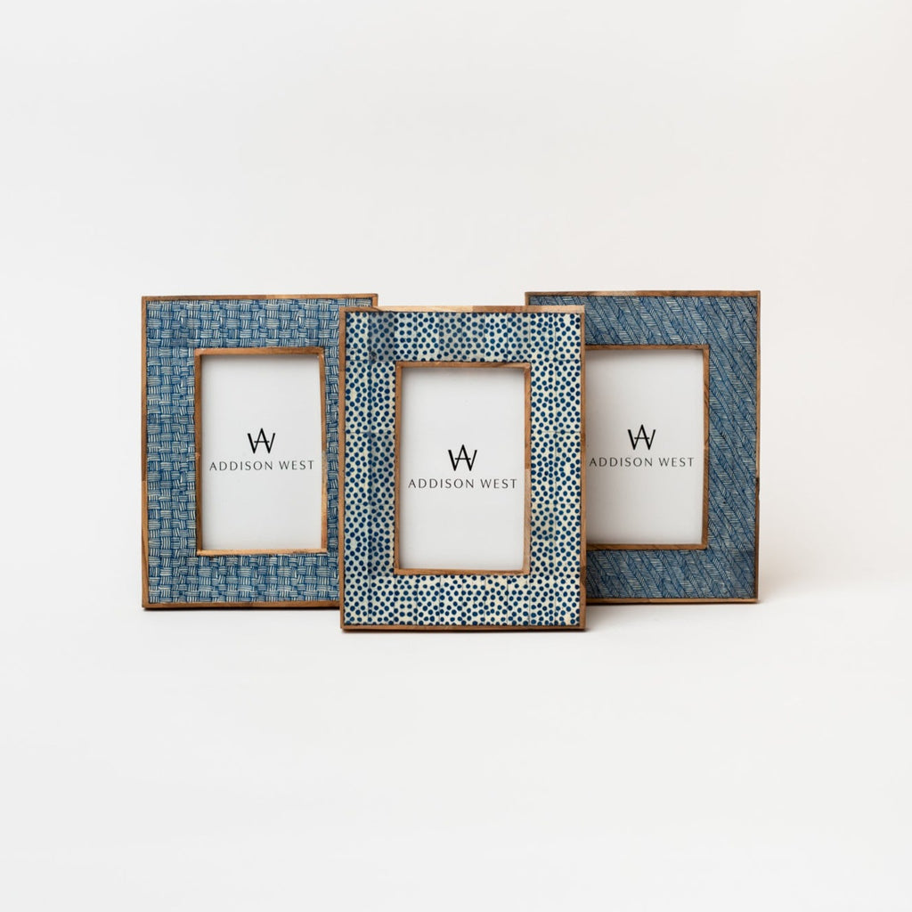 Three picture frames with blue textured finish on a white background