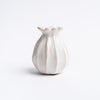 Small sculpted bud vase in white from Addison West home goods on a white background