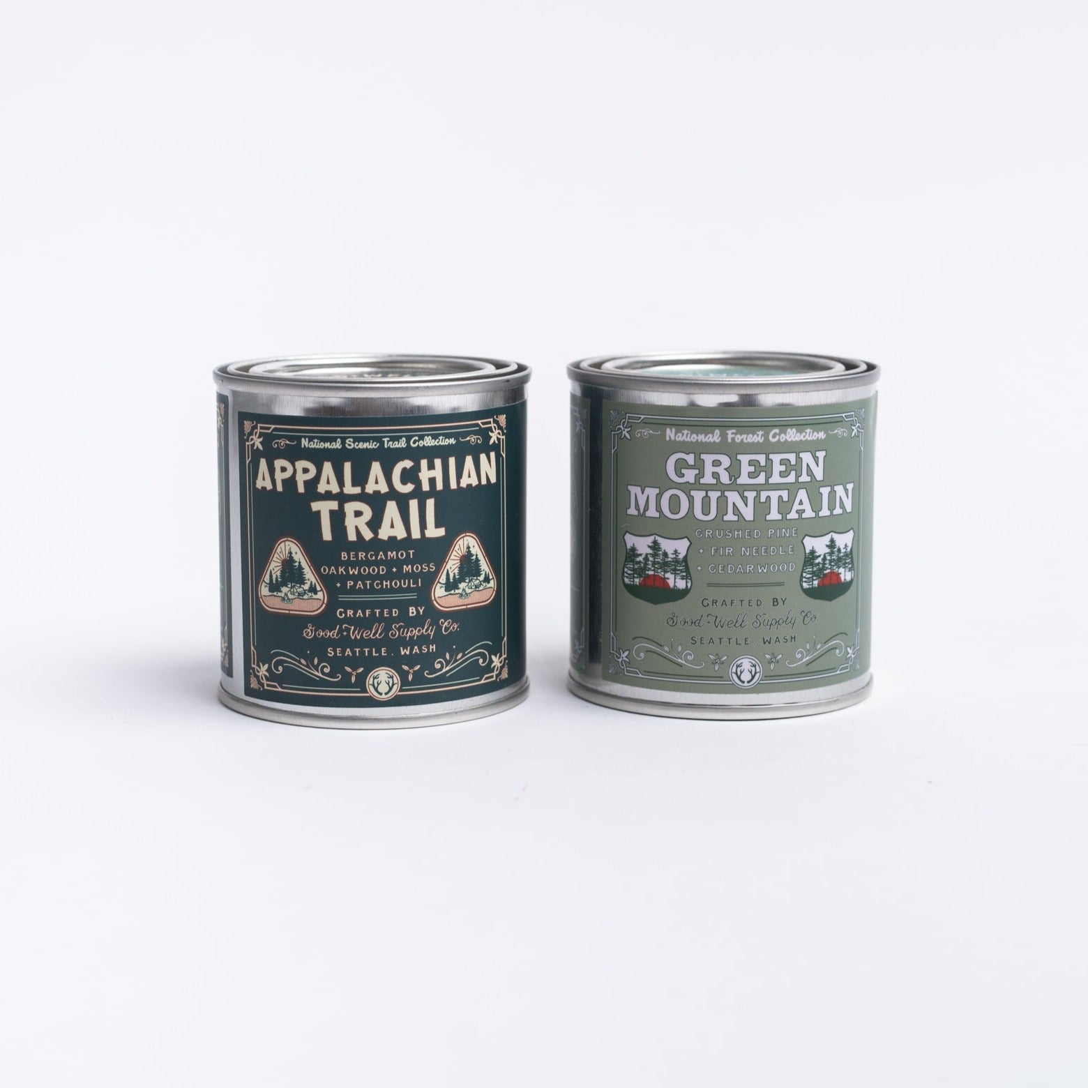 Appalachian trail candle and green mountain candle in tin on a white background