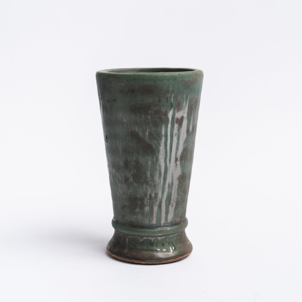 Aged olive dripped glaze vase on a white background  from Addison West