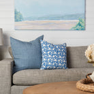 Lina Linen 24" Square Pillow in Arctic Blue and Periwinkle Blockprint 20" Pillow on a beige sofa at Addison West