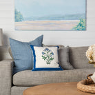 Lina Linen 20" Square Pillow in Grey, Lina Linen 24" Square Pillow in Arctic Blue, Botanical Study Blockprint 18" Pillow on a 
 beige sofa at Addison West