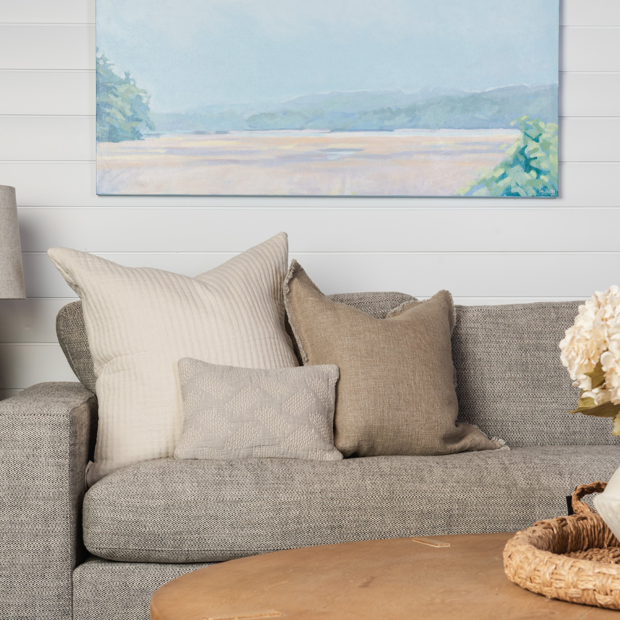 Woven Cotton Jacquard Petite Lumbar Pillow on a beige sofa at Addison West