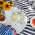 Bubble Glass Pitcher on a white tray on a picnic blanket at Addison West