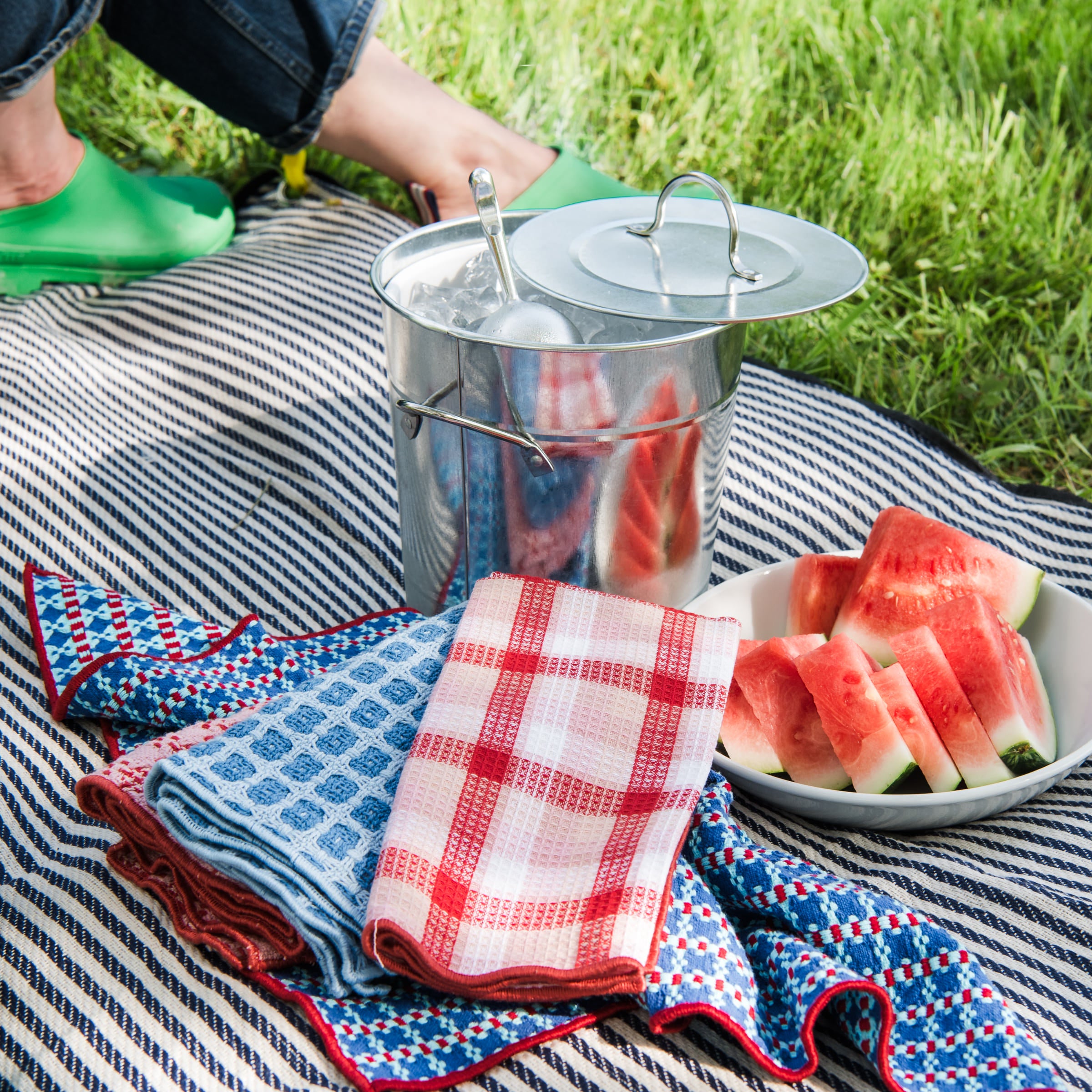 Galvanized Metal Ice Bucket and Bistro Cotton Waffle Weave Napkins on a picnic blanket at Addison West