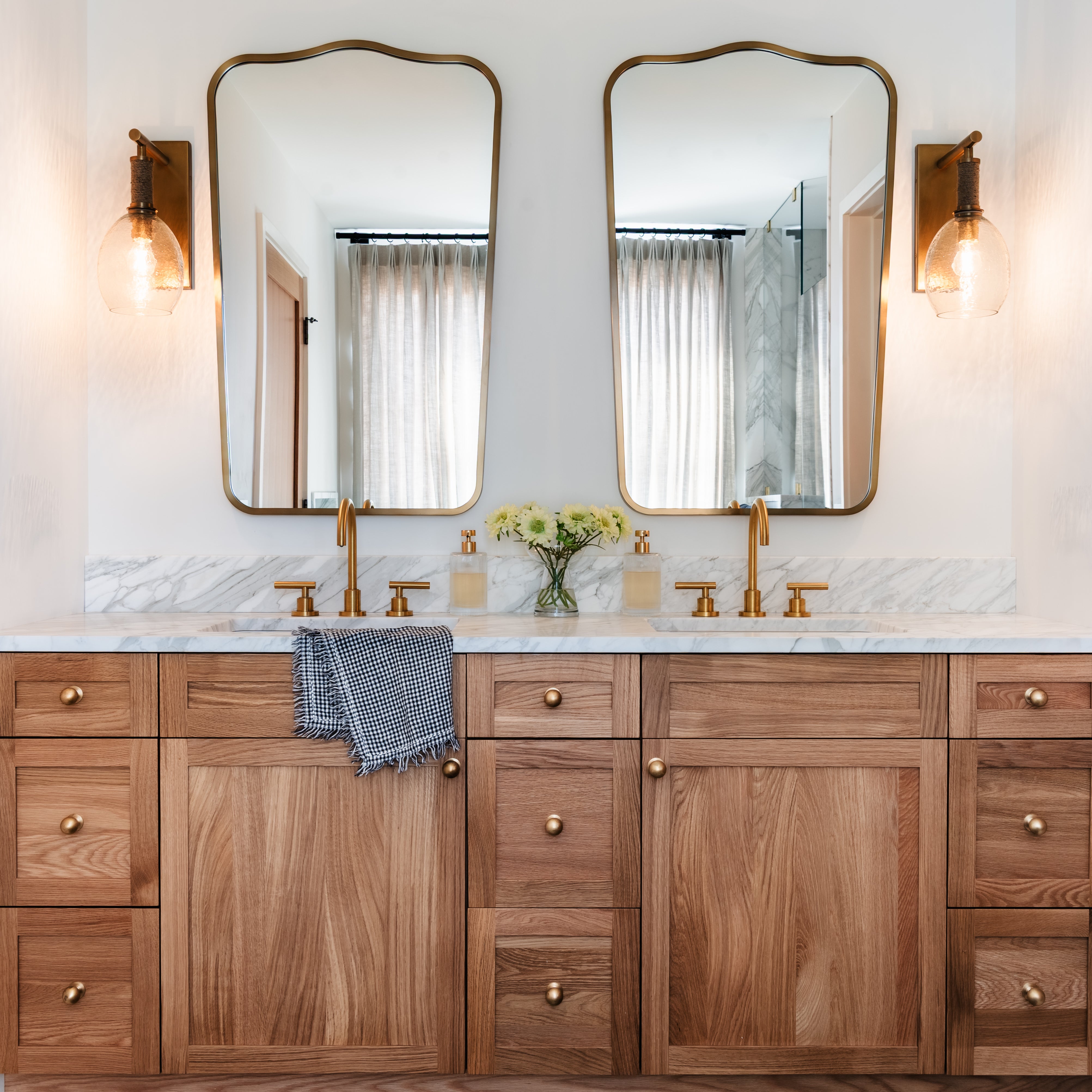 Palecek Bronson Sconce In Brass in a bathroom at Addison West