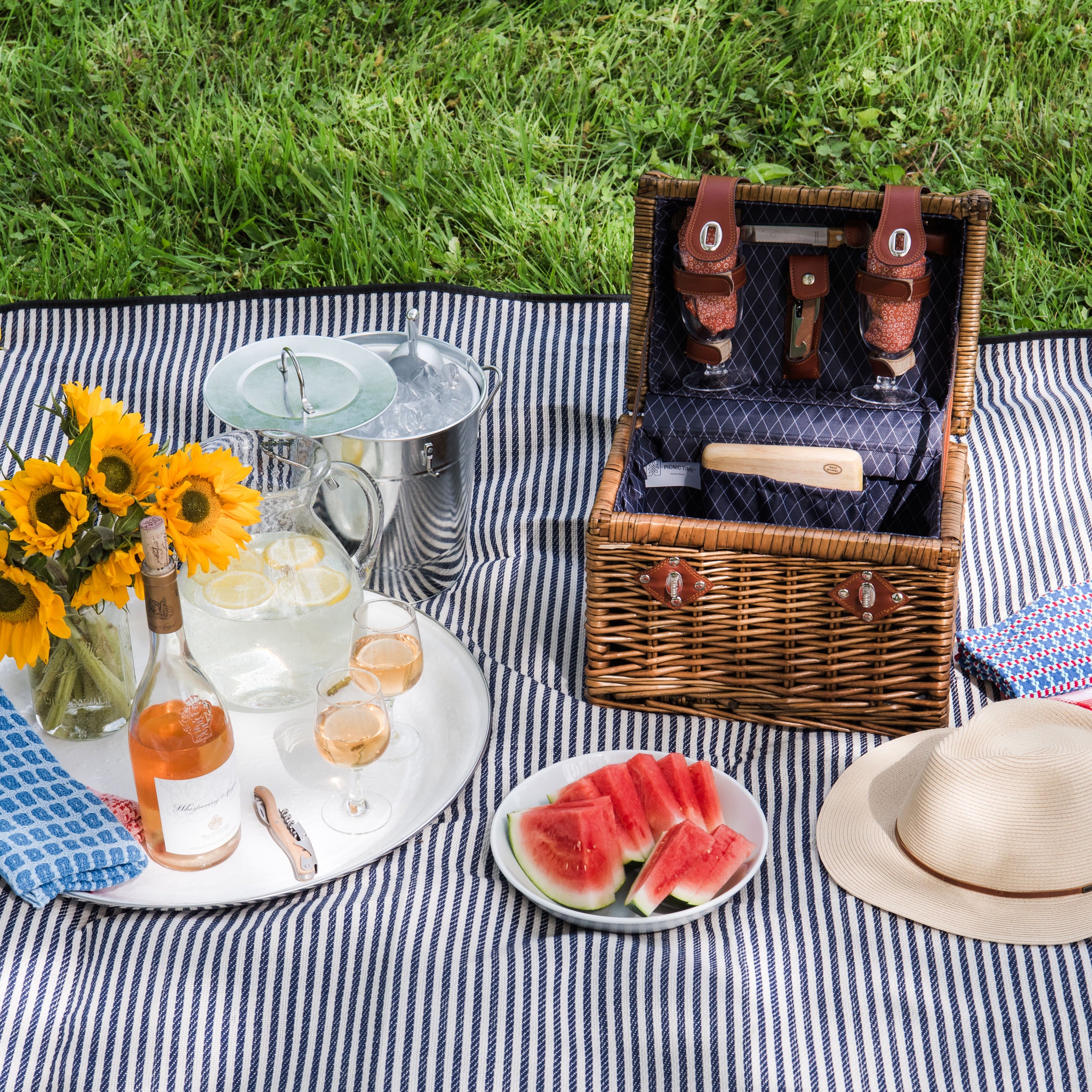 Wine & Cheese Picnic Basket on a picnic blanket at Addison West