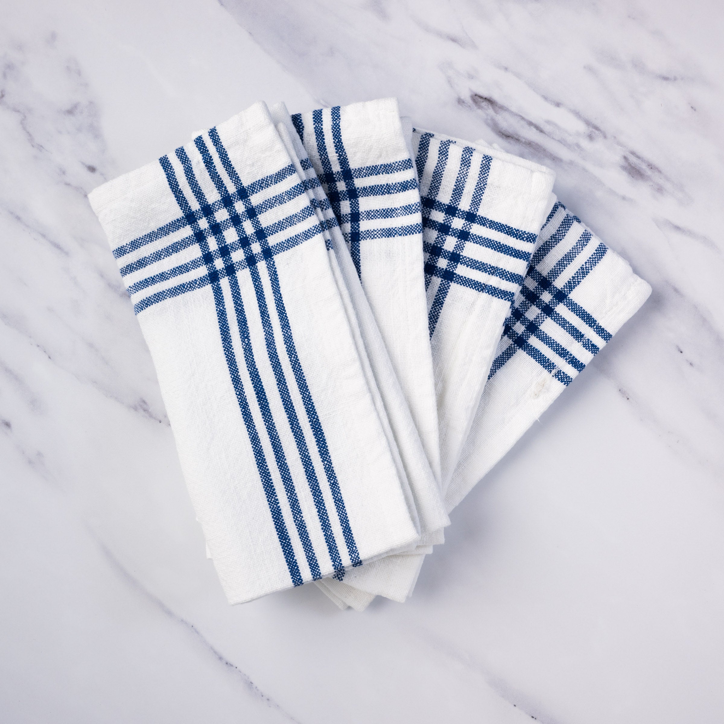 Farmhouse Napkin in Blue, Set of 4 on a kitchen counter at Addison West