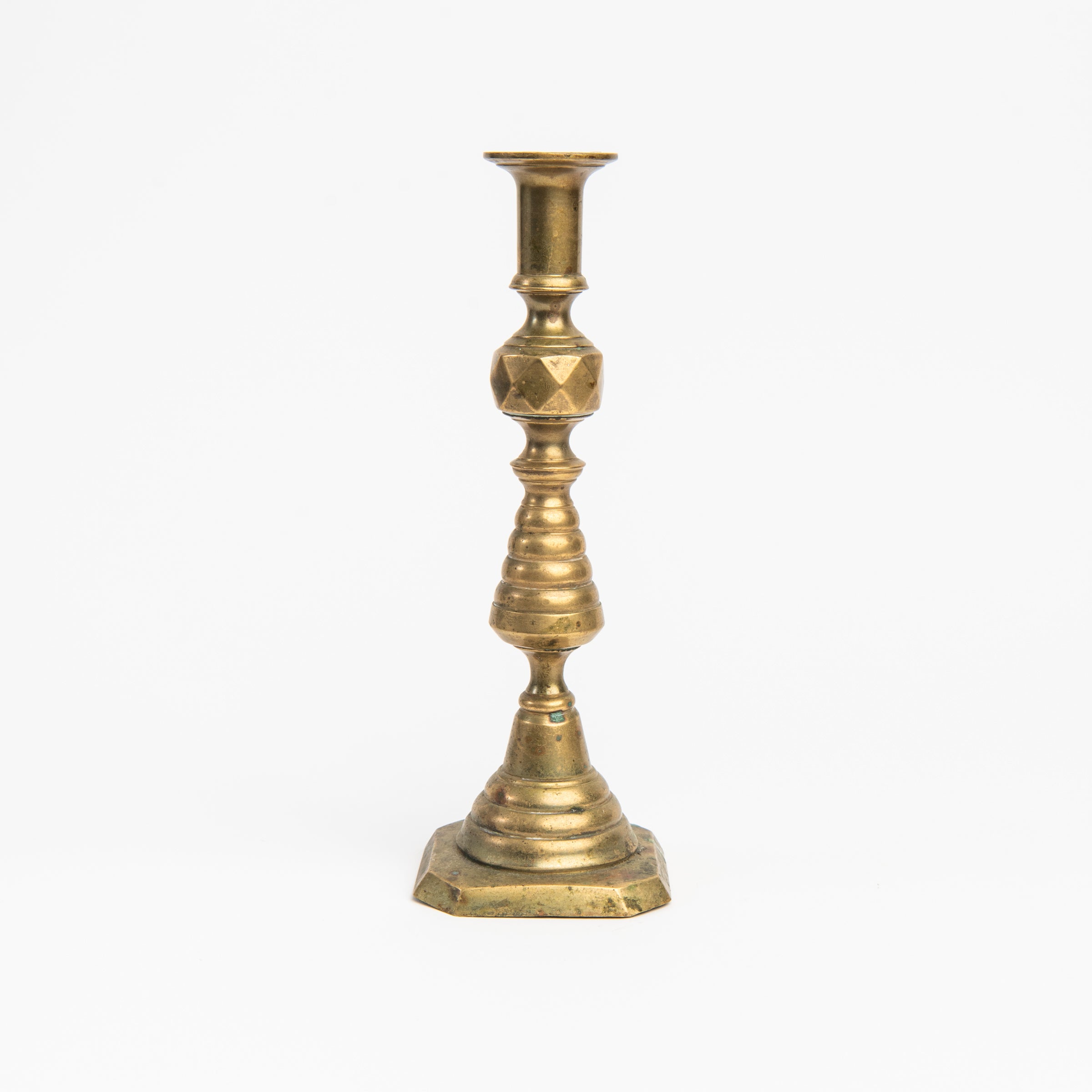 Vintage Brass Geometric Candlesticks on a white background at Addison West