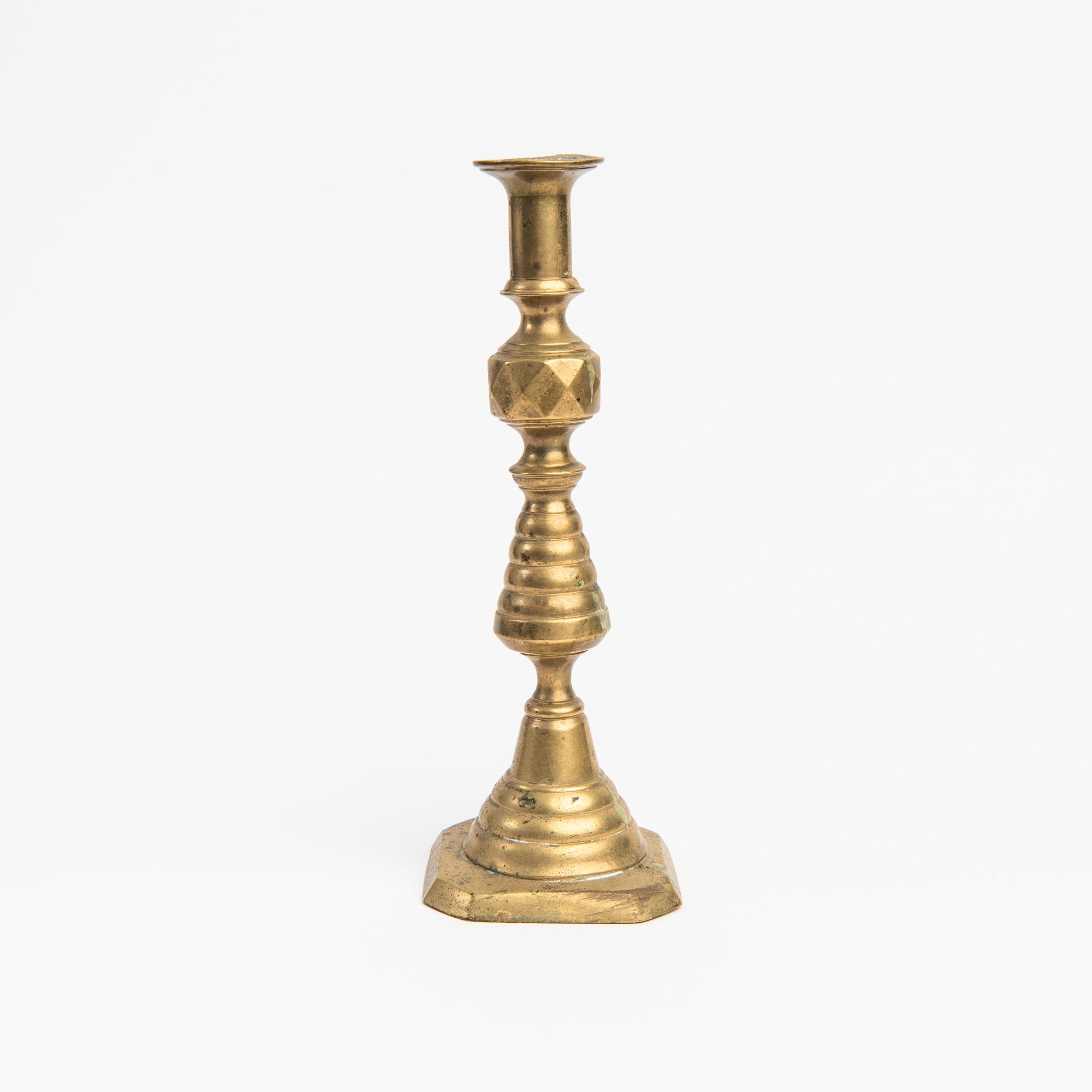 Vintage Brass Geometric Candlesticks on a white background at Addison West
