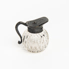 Vintage Round Victorian Syrup Pitcher on a white background at Addison West