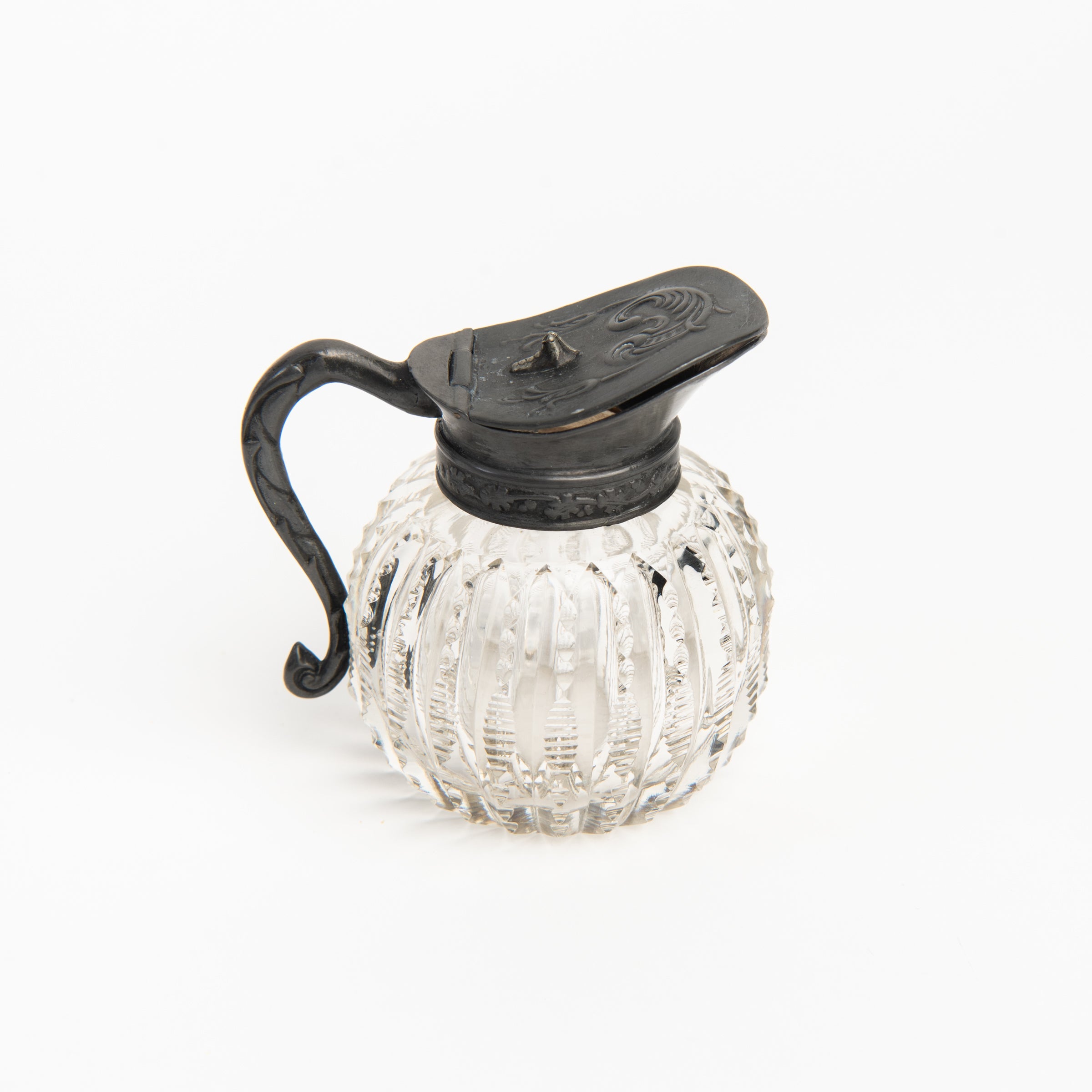 Vintage Round Victorian Syrup Pitcher on a white background at Addison West