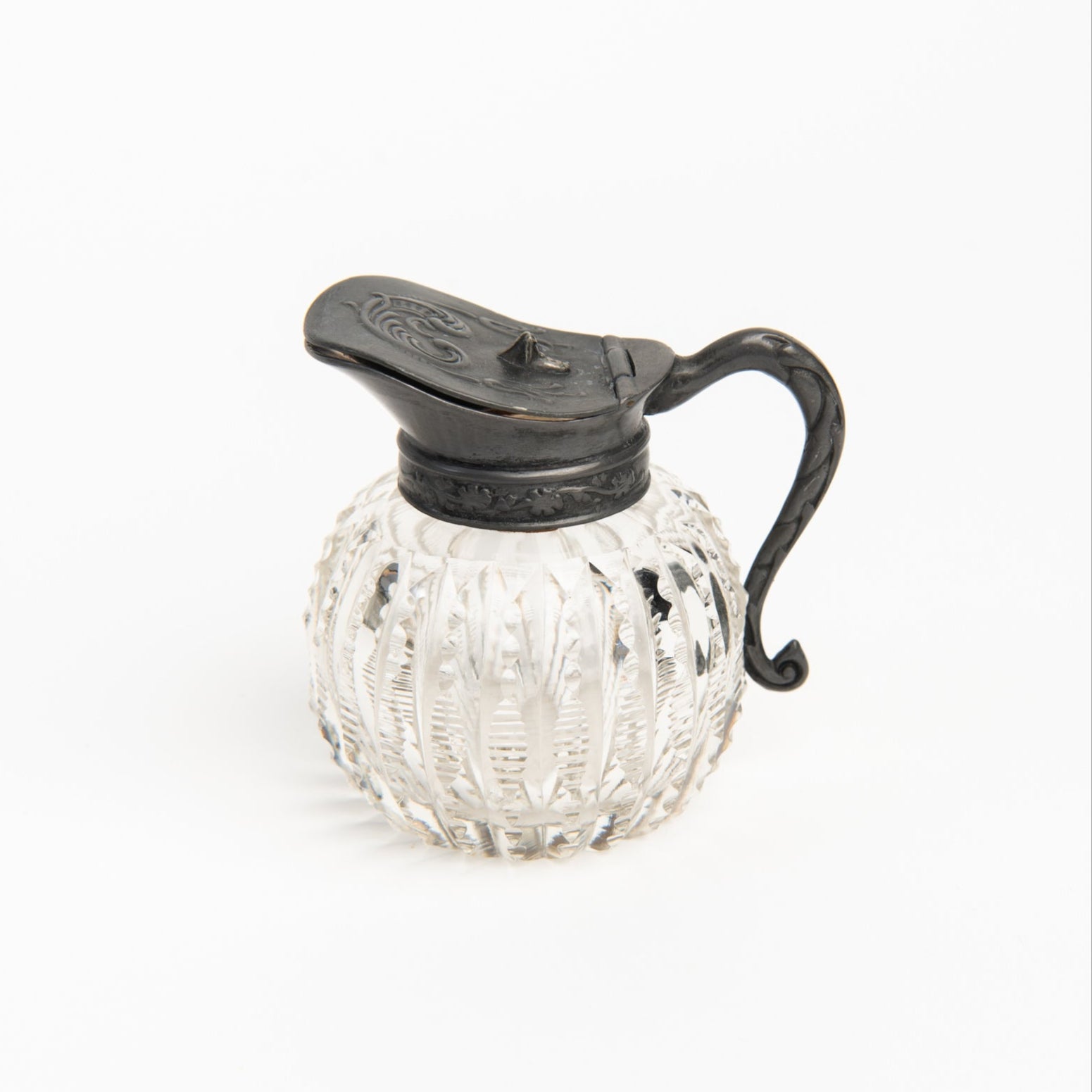 Vintage Round Victorian Syrup Pitcher on a white background at Addison West