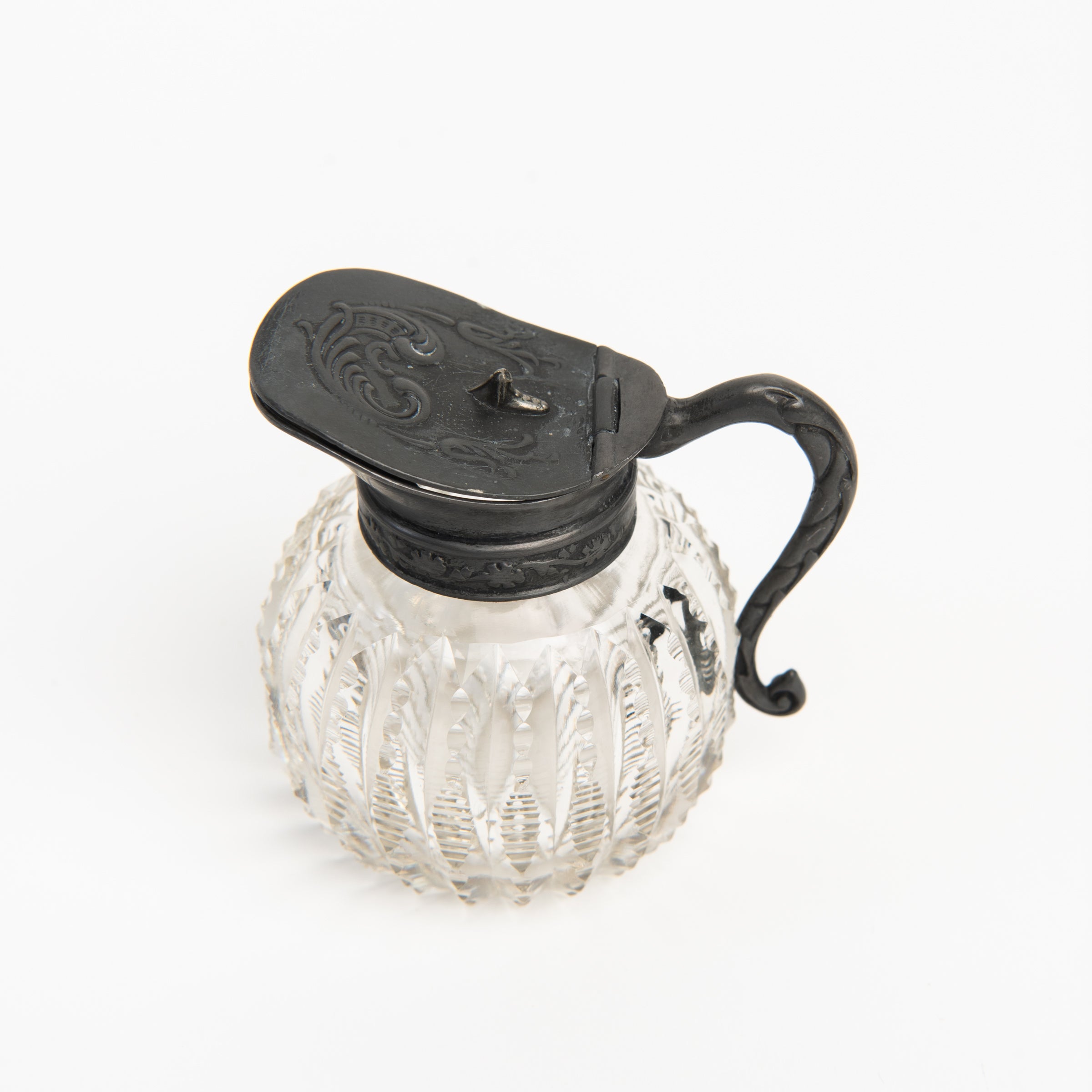 Vintage Round Victorian Syrup Pitcher on a white background at Addison West