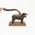 Vintage Bronze Dog Nutcracker on a white background at Addison West