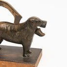 Close up of Vintage Bronze Dog Nutcracker on a white background at Addison West