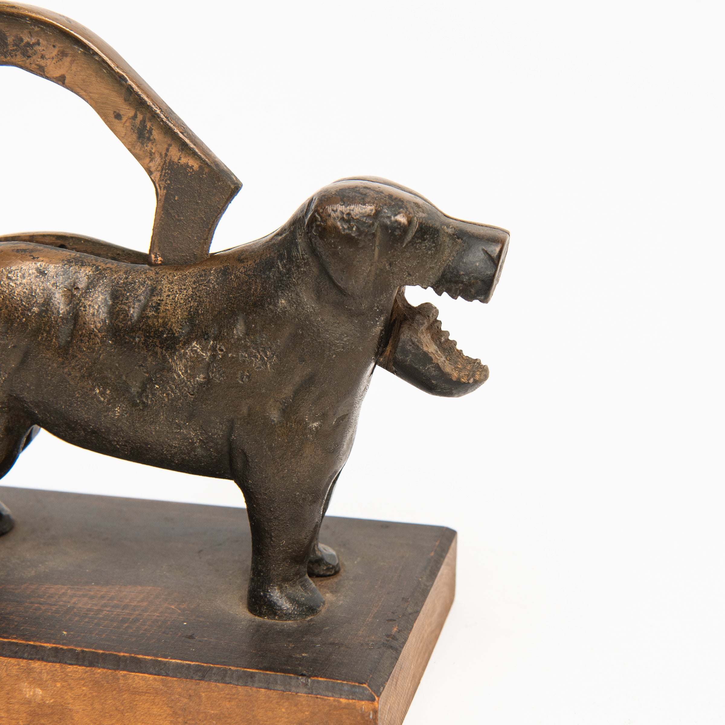 Close up of Vintage Bronze Dog Nutcracker on a white background at Addison West