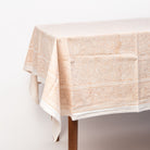 Clementine Block Print Tablecloth on a table on a white background at Addison West