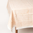 Clementine Block Print Tablecloth on a table on a white background at Addison West