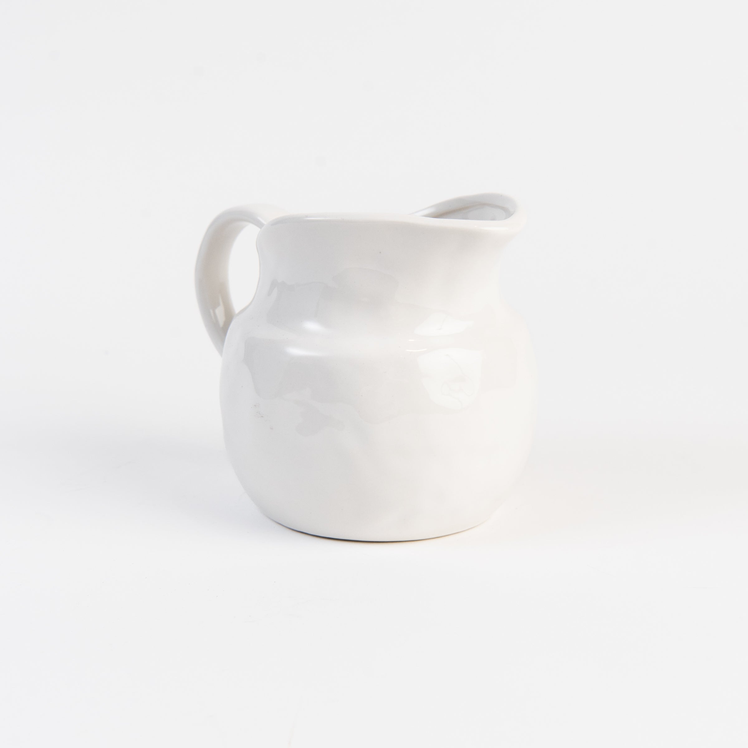 Stoneware Vintage Pitcher on a white background at Addison West