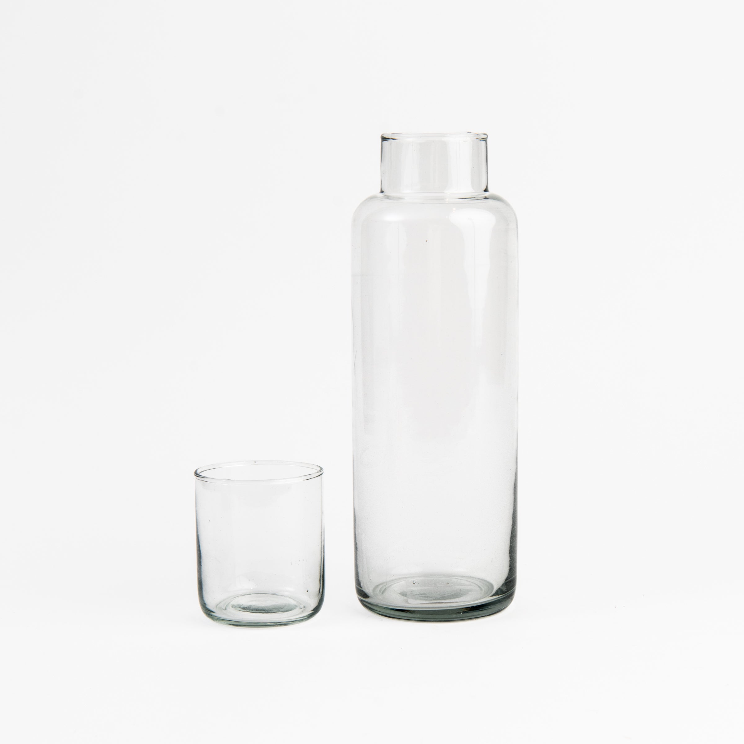 Recycled Glass Decanter with Drinking Glass on a white background at Addison West