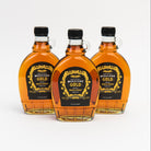 Grace Potter's Midnight Gold Maple Syrup on a white background at Addison West