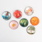 Collection of Saint Austin Company paperweights on a white background at Addison West