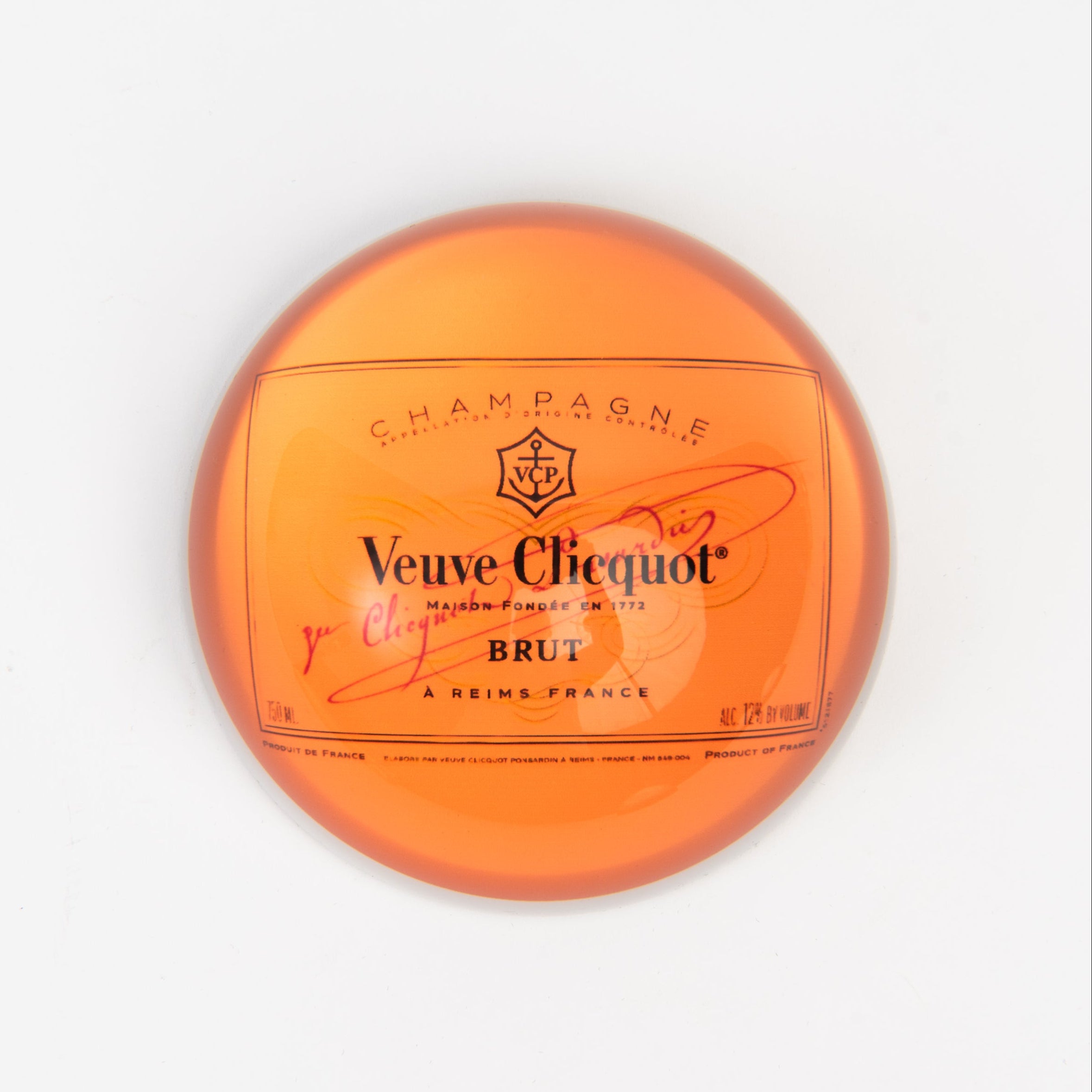 Orange Champagne Paperweight on a white background at Addison West