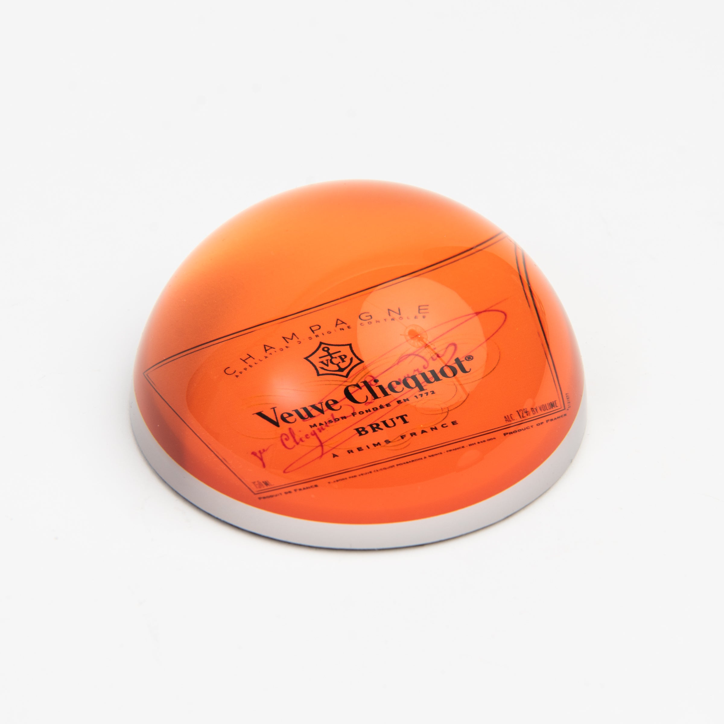 Orange Champagne Paperweight on a white background at Addison West