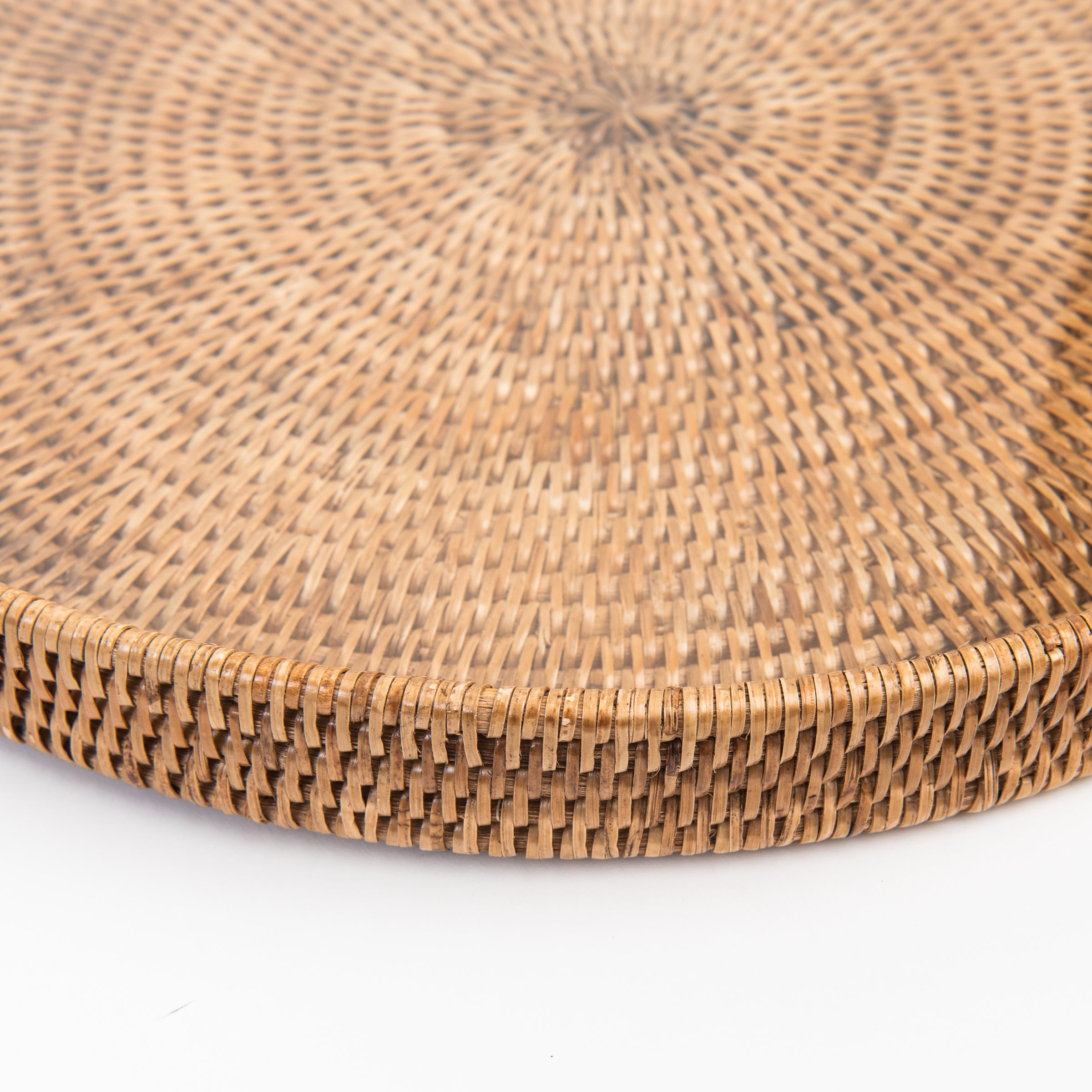 Close up of 19" Round Rattan Tray with Glass Insert on a white background at Addison West