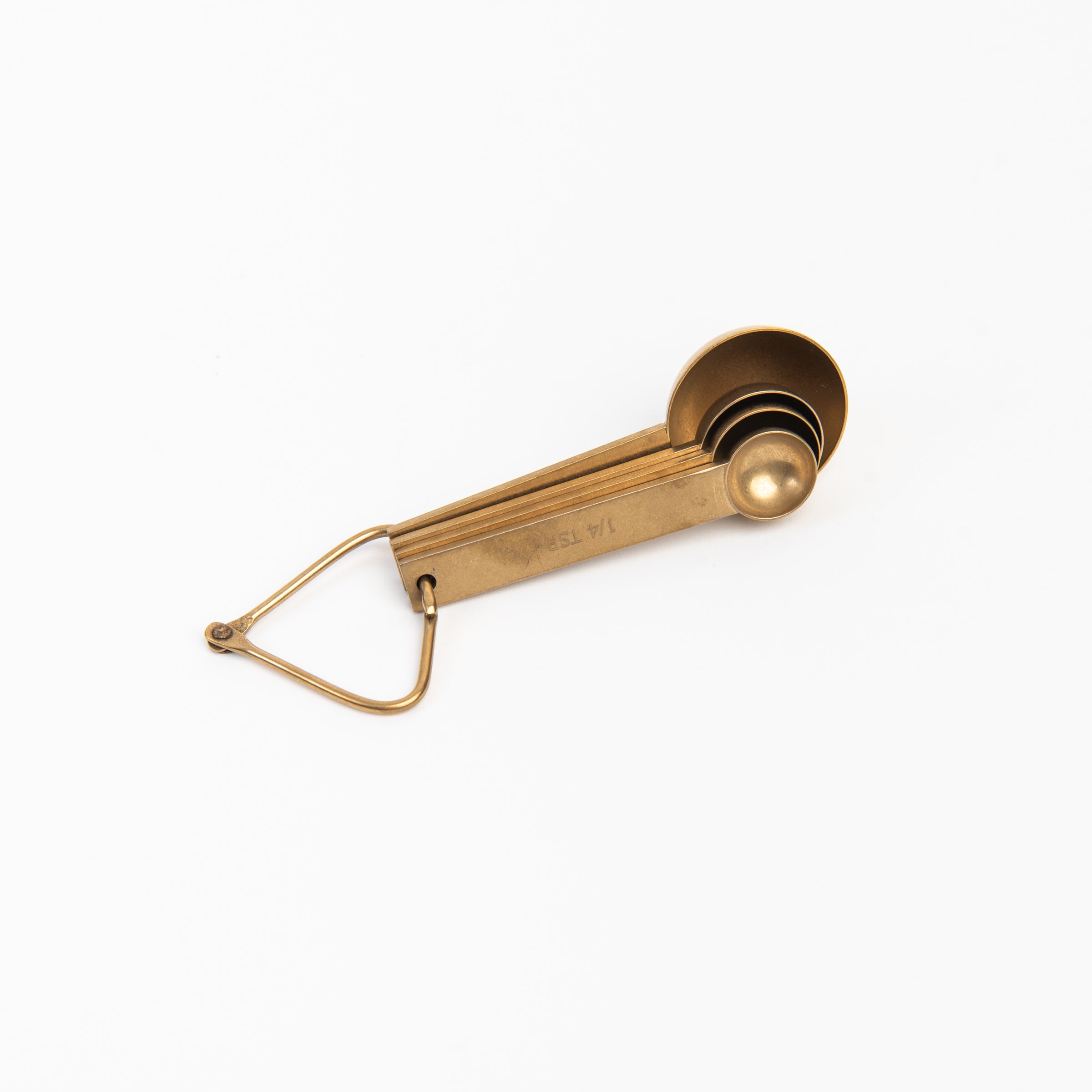 Cultivar Measuring Spoons in Tumbled Gold on a white background at Addison West
