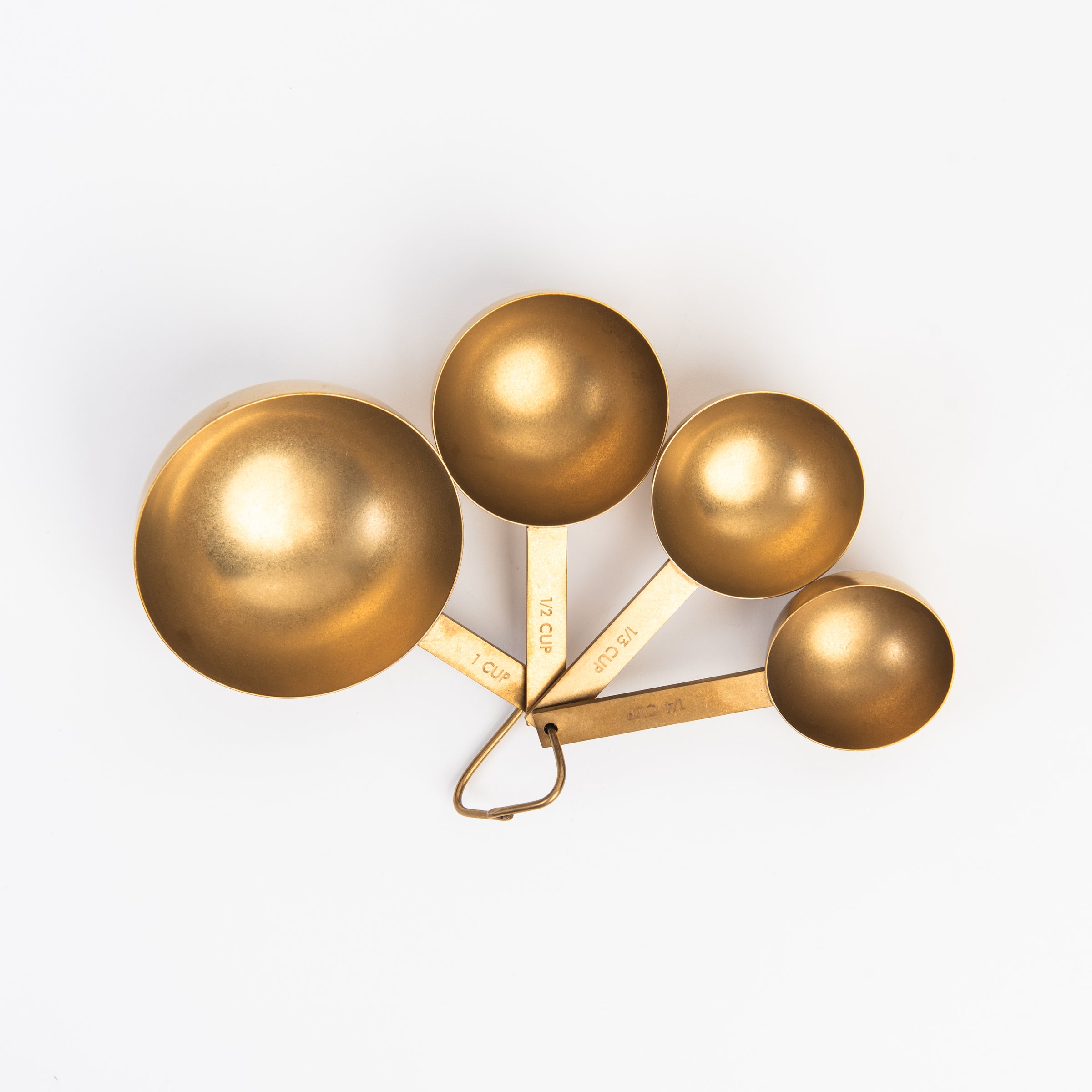Cultivar Measuring Cups in Tumbled Gold on a white background at Addison West
