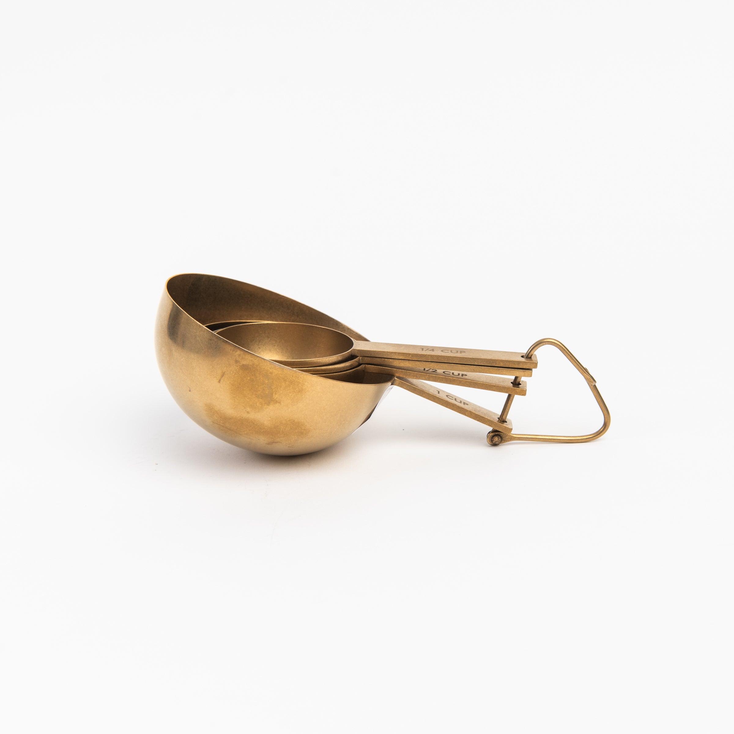 Cultivar Measuring Cups in Tumbled Gold on a white background at Addison West
