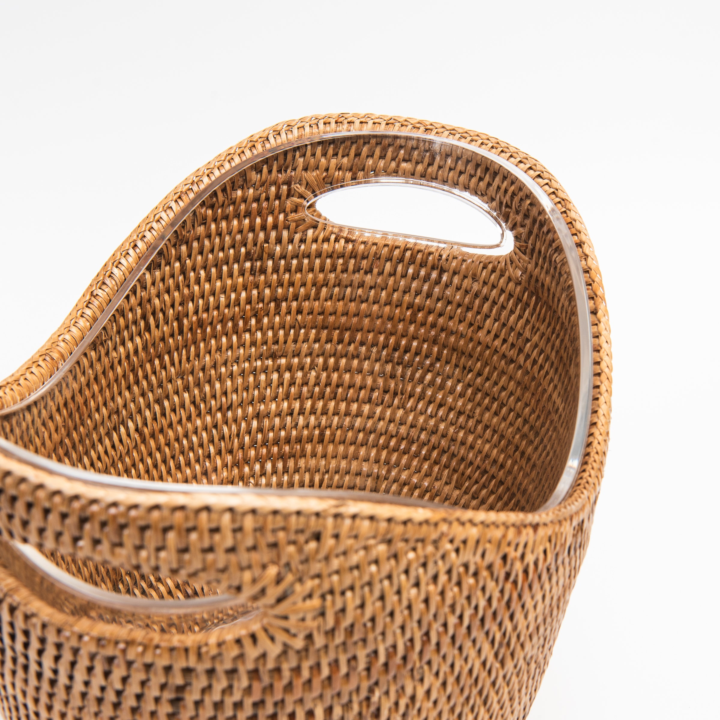 Close up of Rattan Champagne Bucket with Acrylic Insert on a white background at Addison West