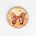 Brown & Orange Moth Paperweight on a white background at Addison West
