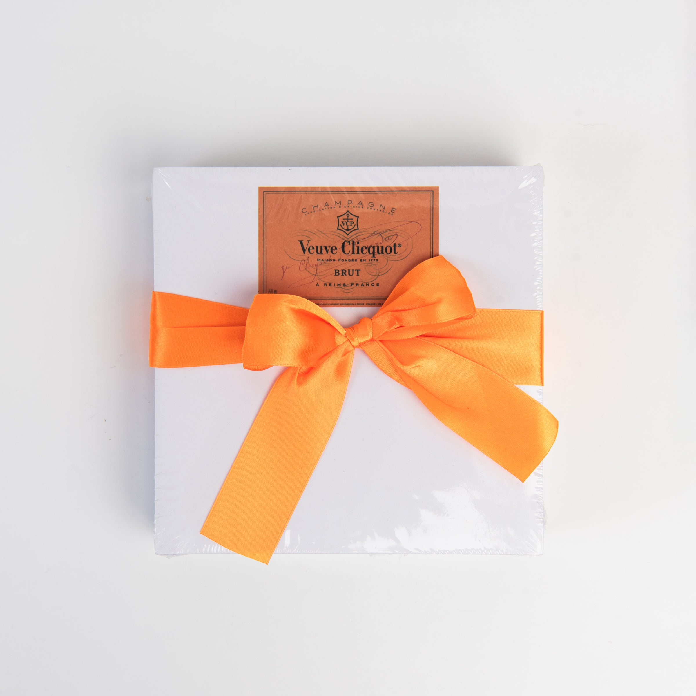 Orange Champagne Notepad on a white background at Addison West