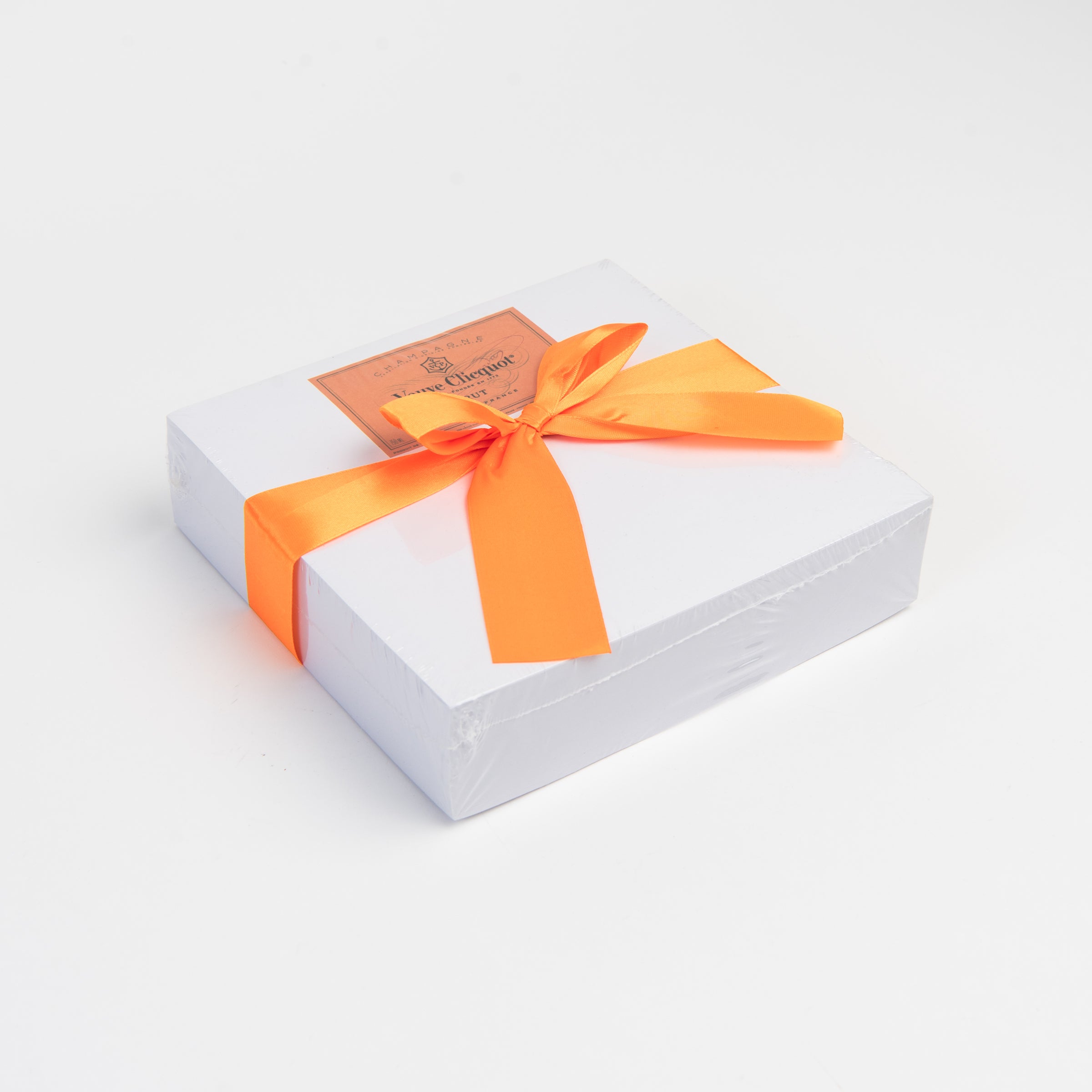 Orange Champagne Notepad on a white background at Addison West