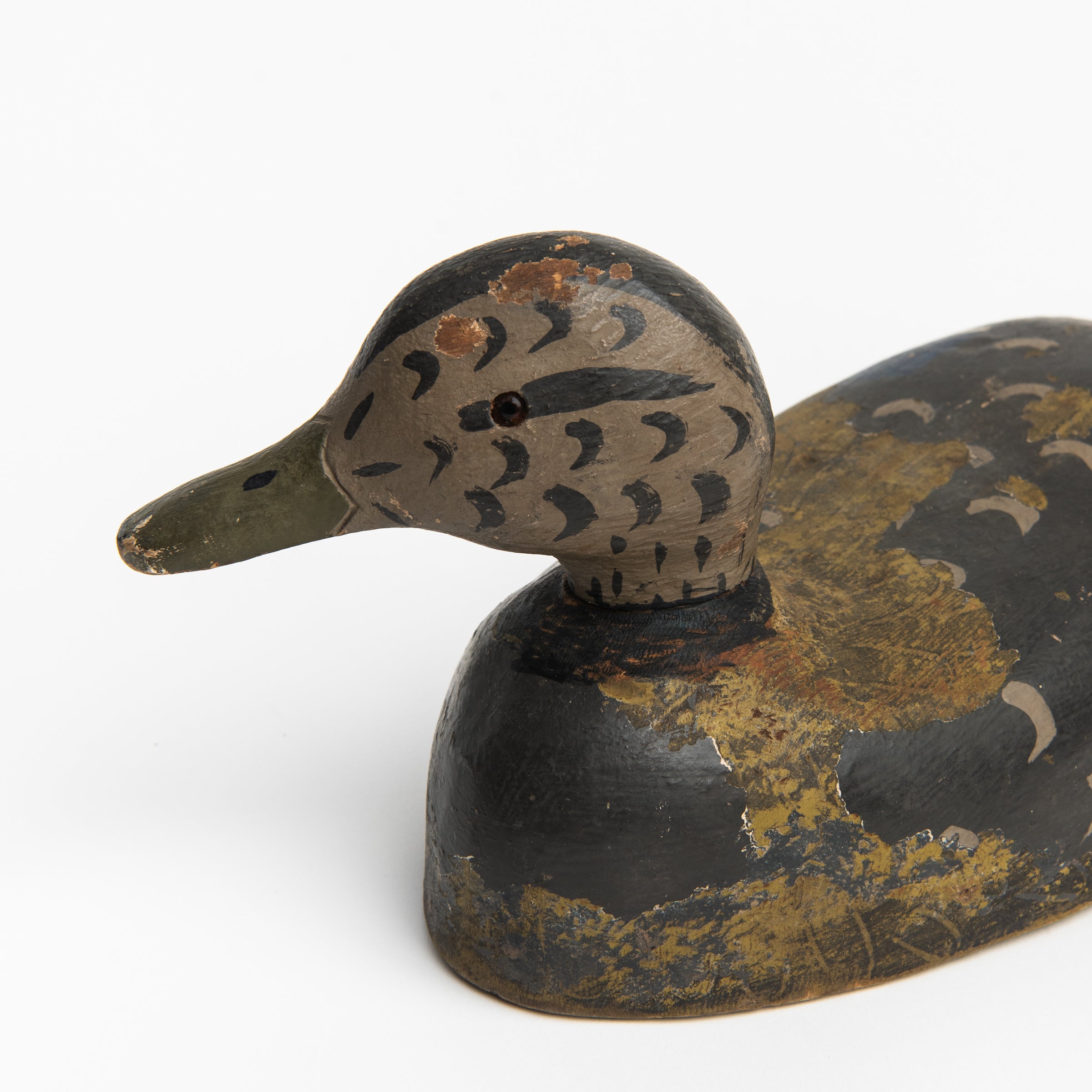 Close up of Vintage Wood Decoy on a white background at Addison West