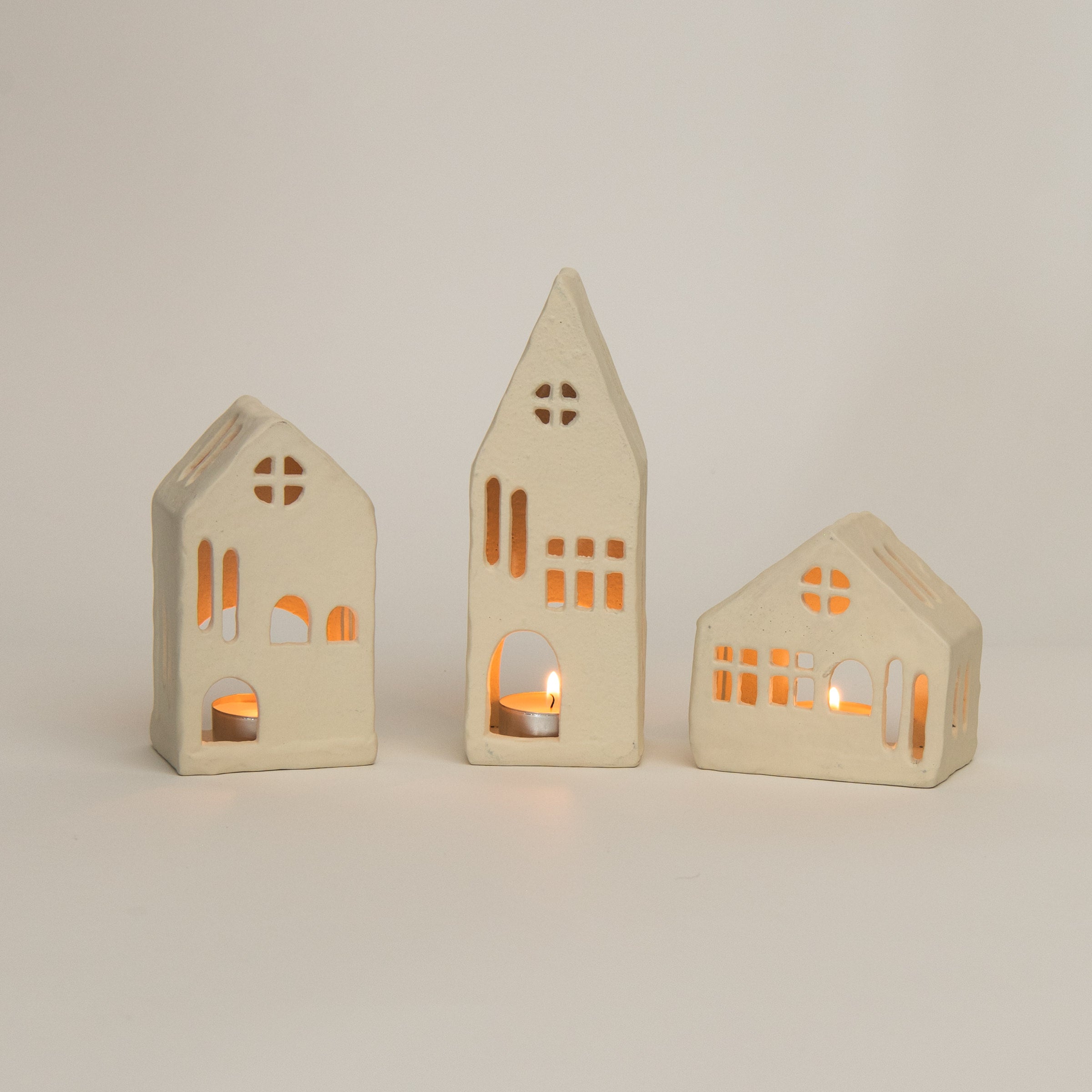 Aspen Tealight House on a white background at Addison West