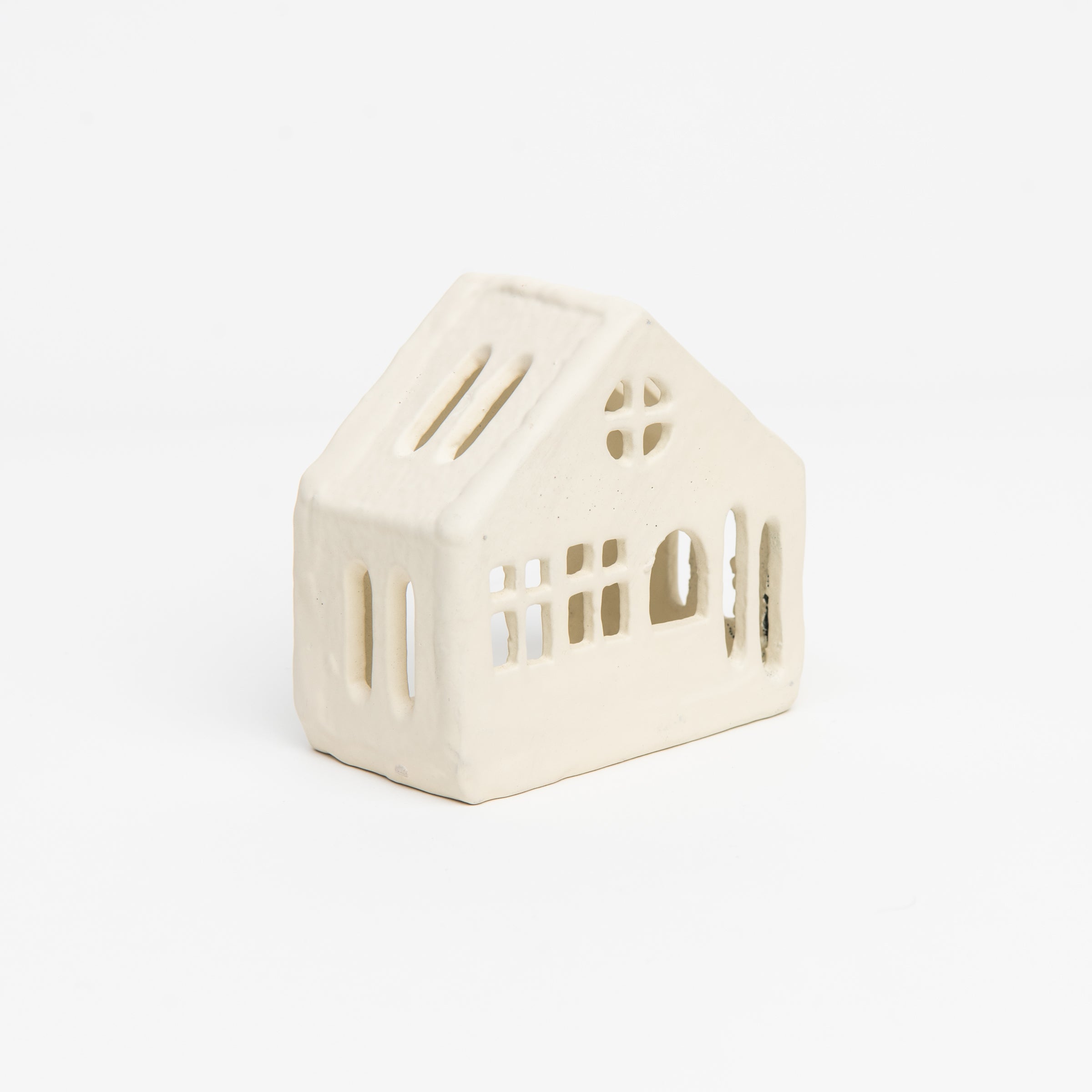 Aspen Tealight House on a white background at Addison West