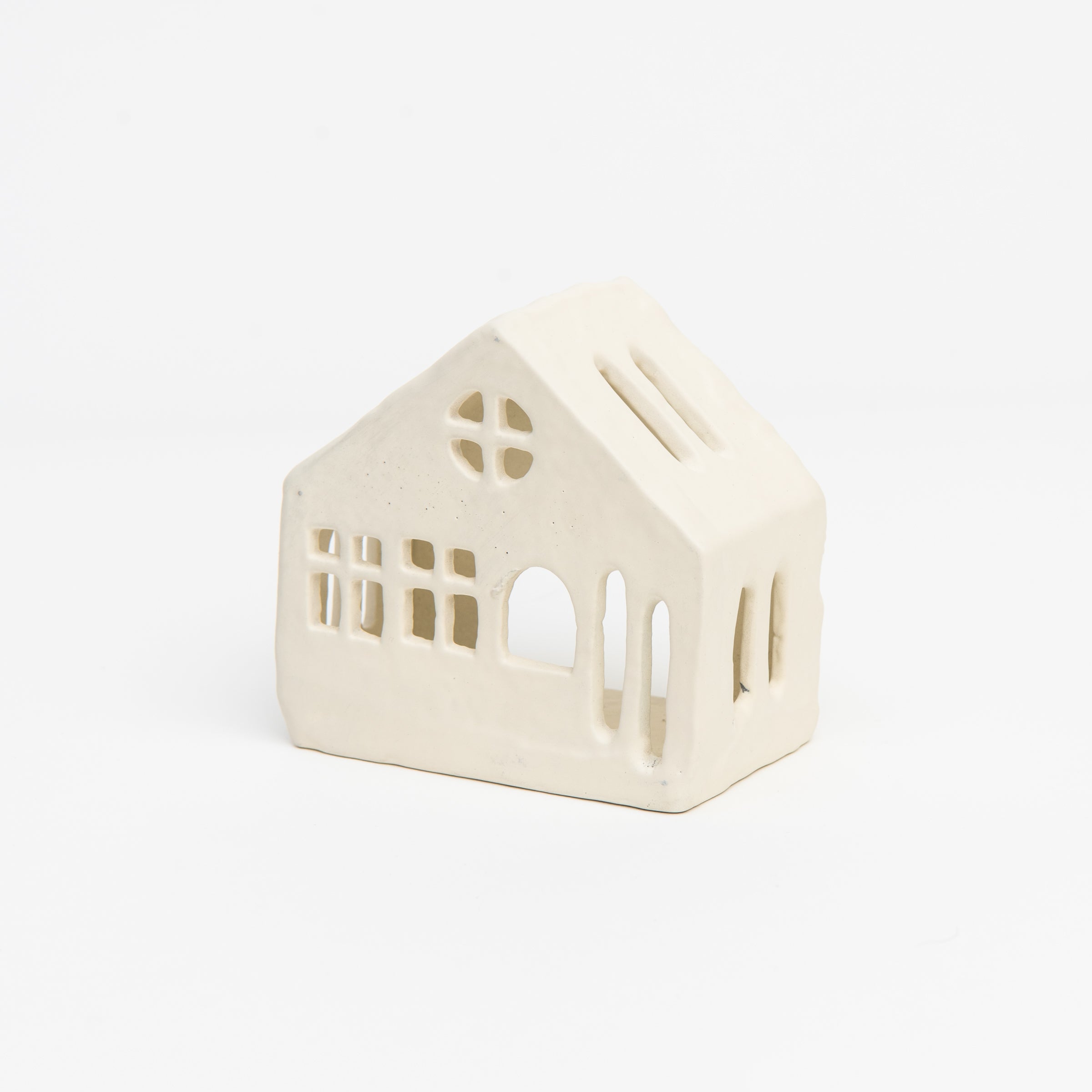 Aspen Tealight House on a white background at Addison West