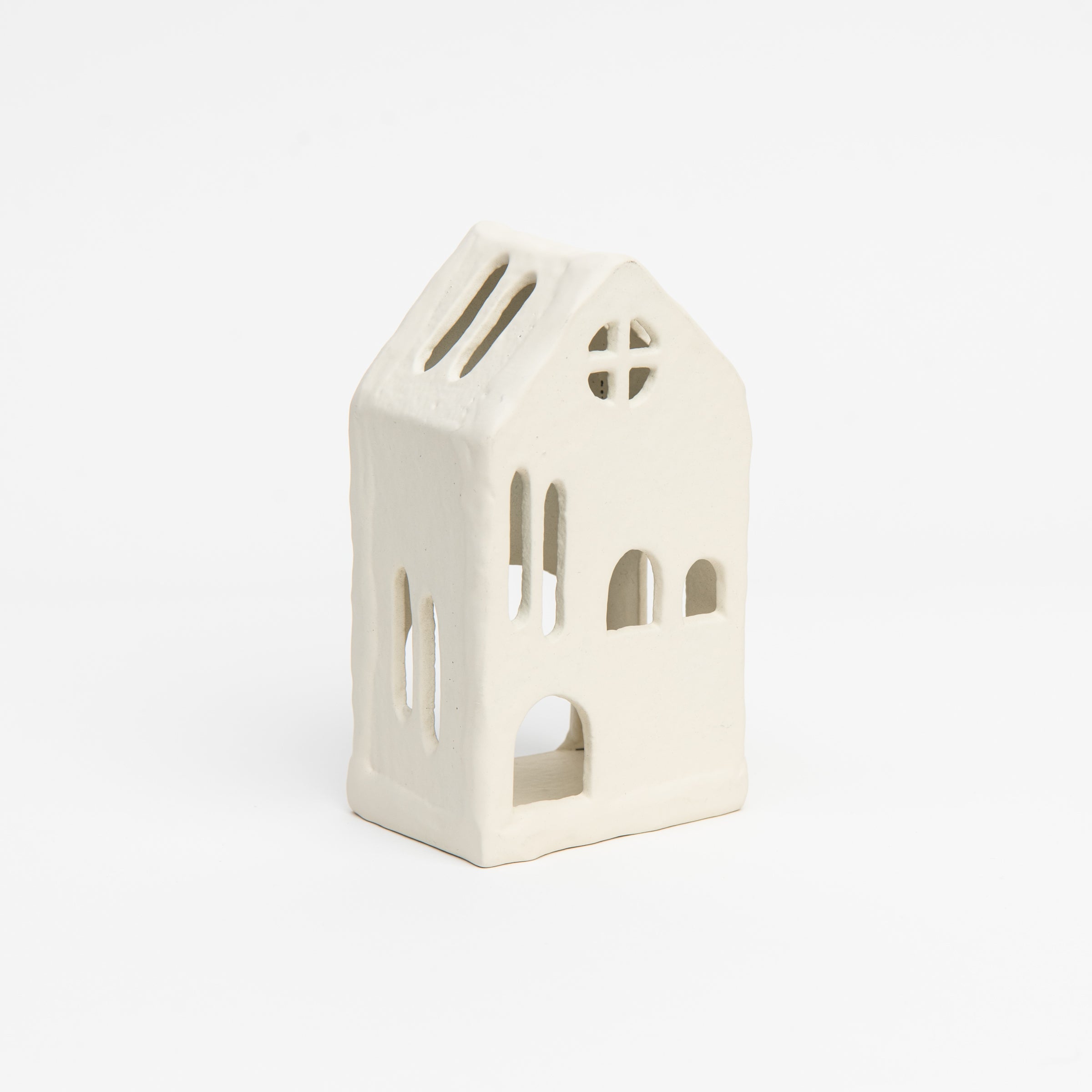 Aspen Tealight House on a white background at Addison West