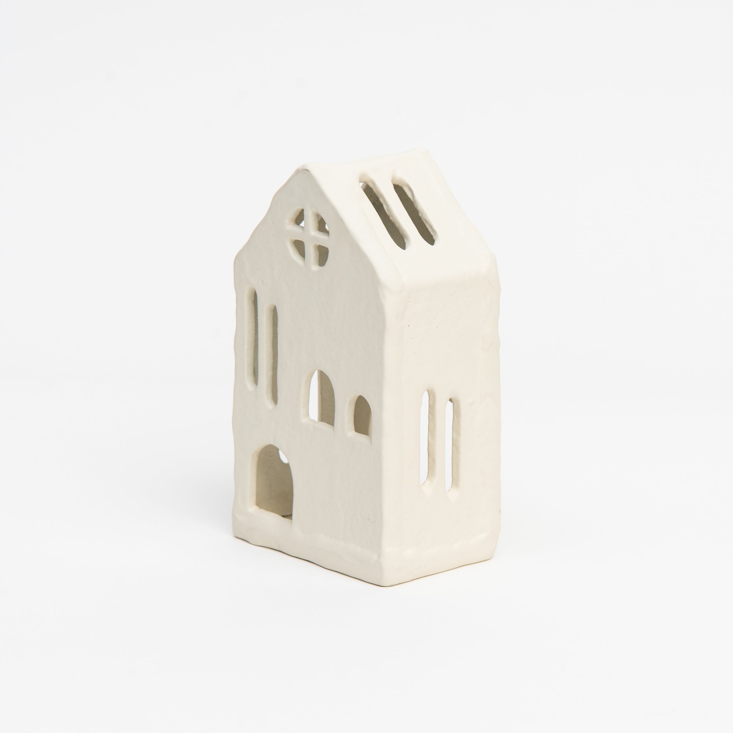 Aspen Tealight House on a white background at Addison West