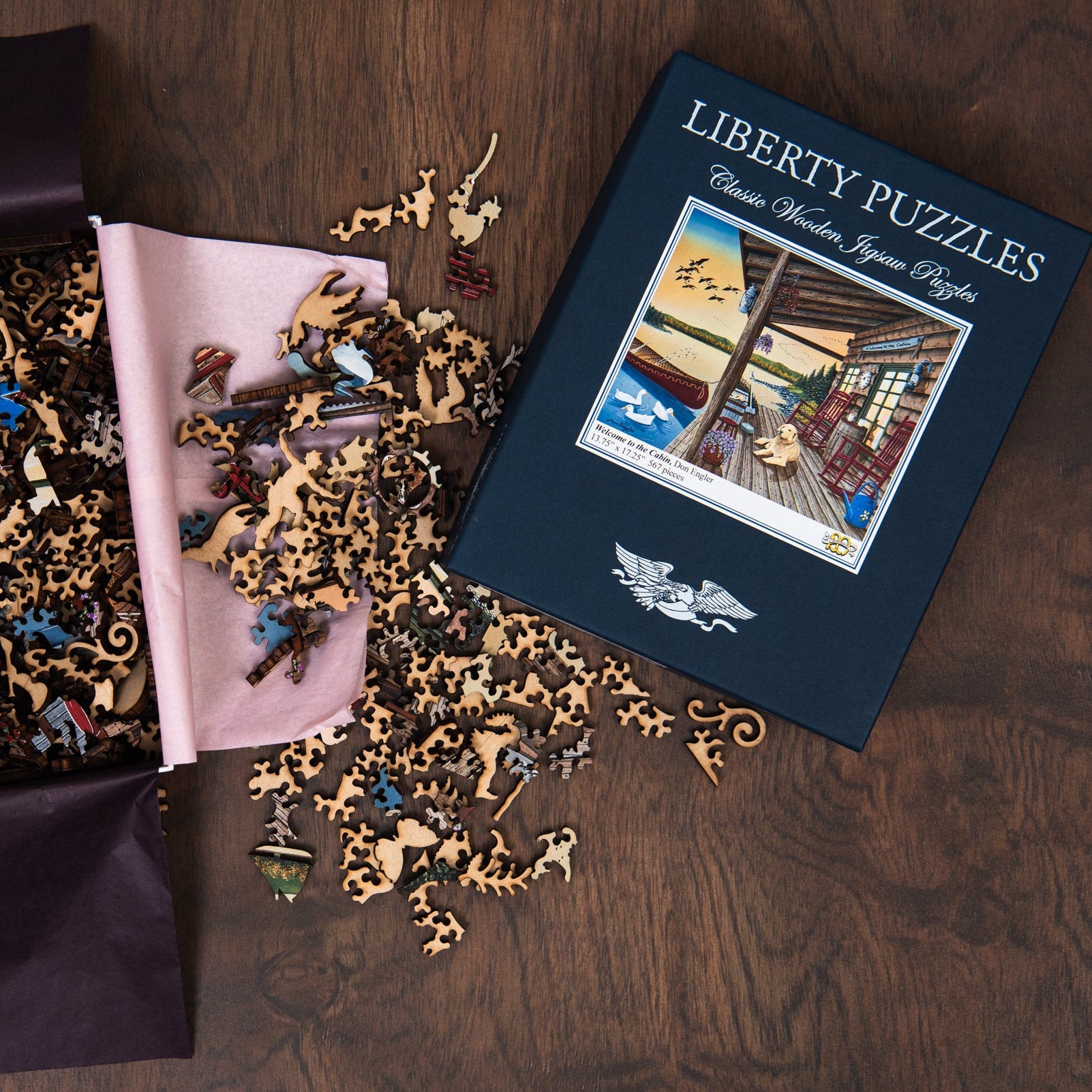 Liberty Puzzle Welcome to the Cabin on a wood table at Addison West