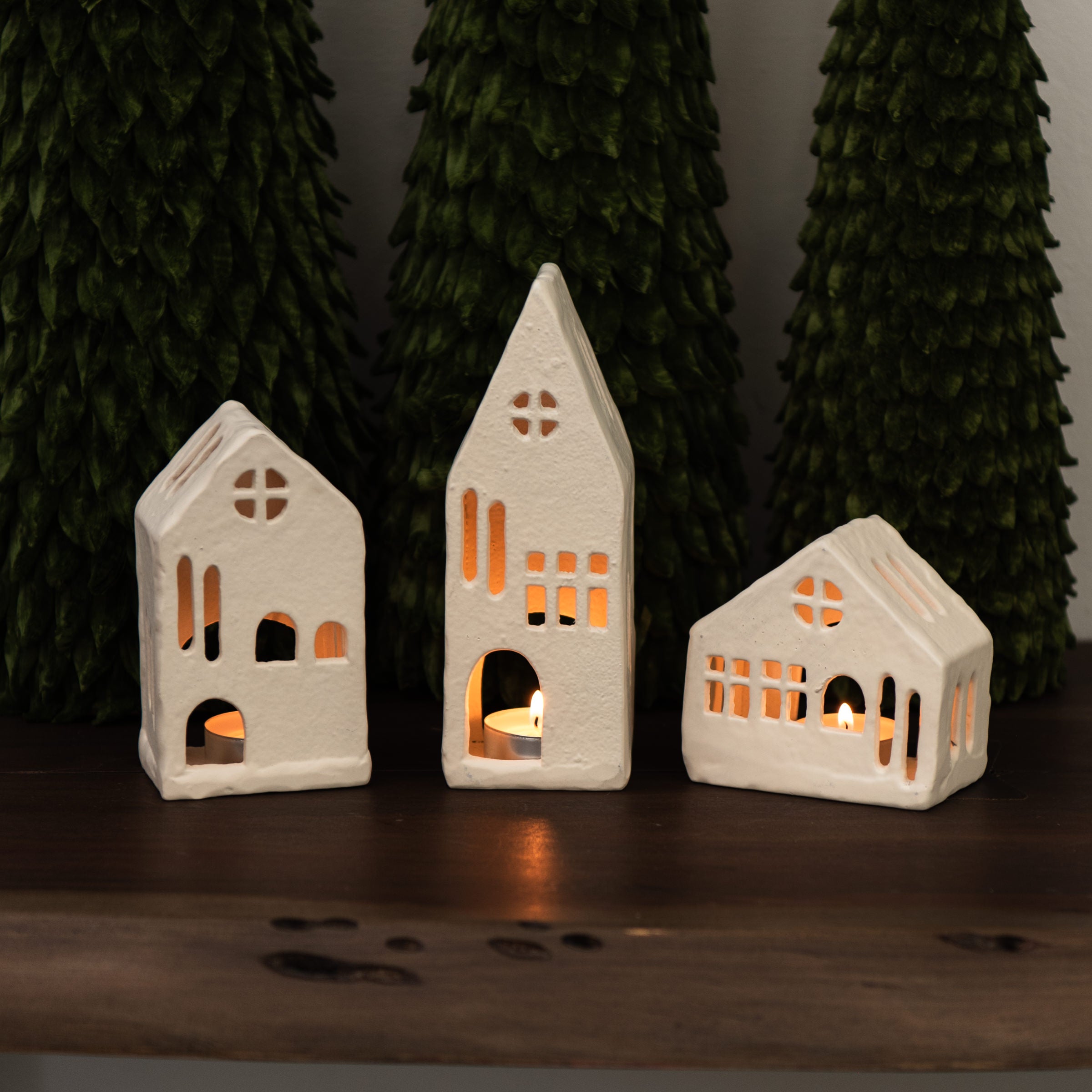 Aspen Tealight House on a wood table at Addison West