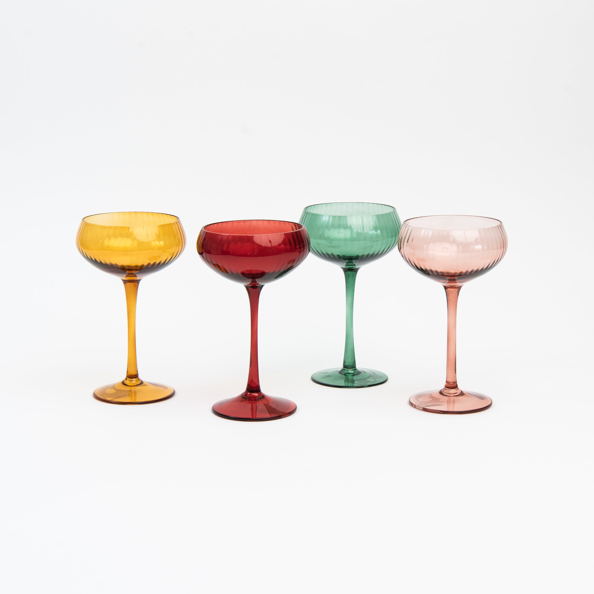 Cheers to You Glass colorful champagne glasses on a white background at Addison West