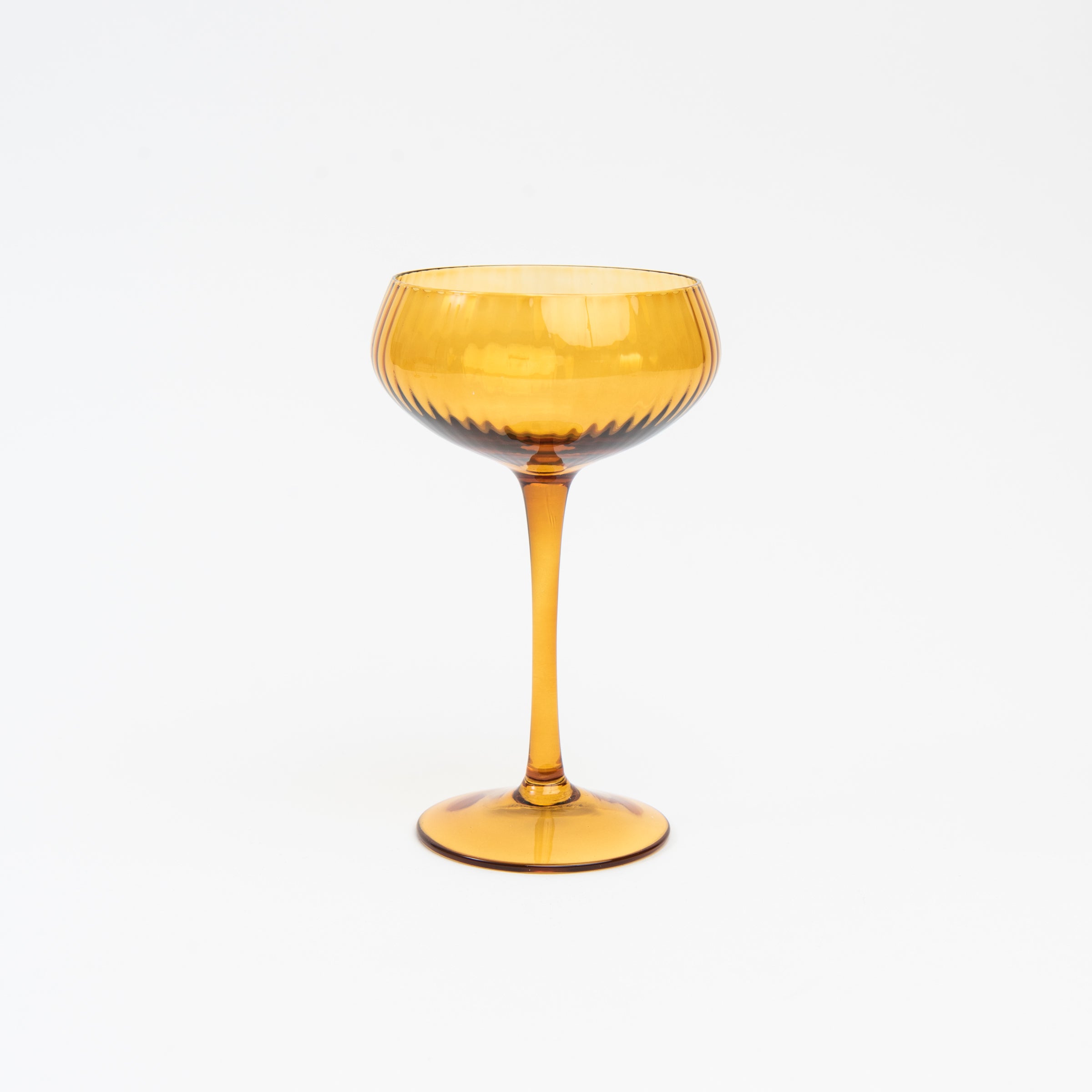 Cheers to You Glass in Amber on a white background at Addison West