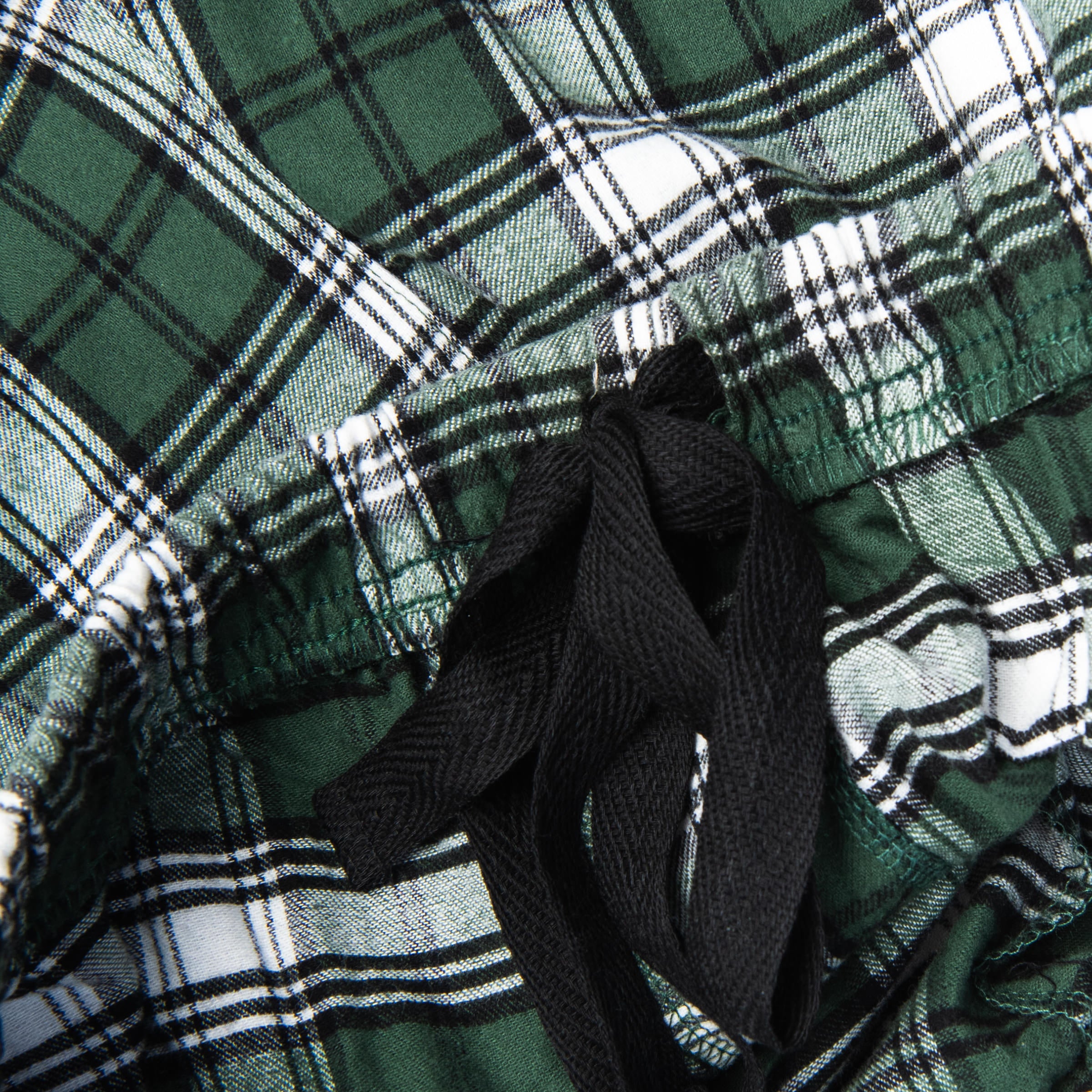Close up of SKI VT Men's Flannel Pant in Green Plaid on a white background at Addison West