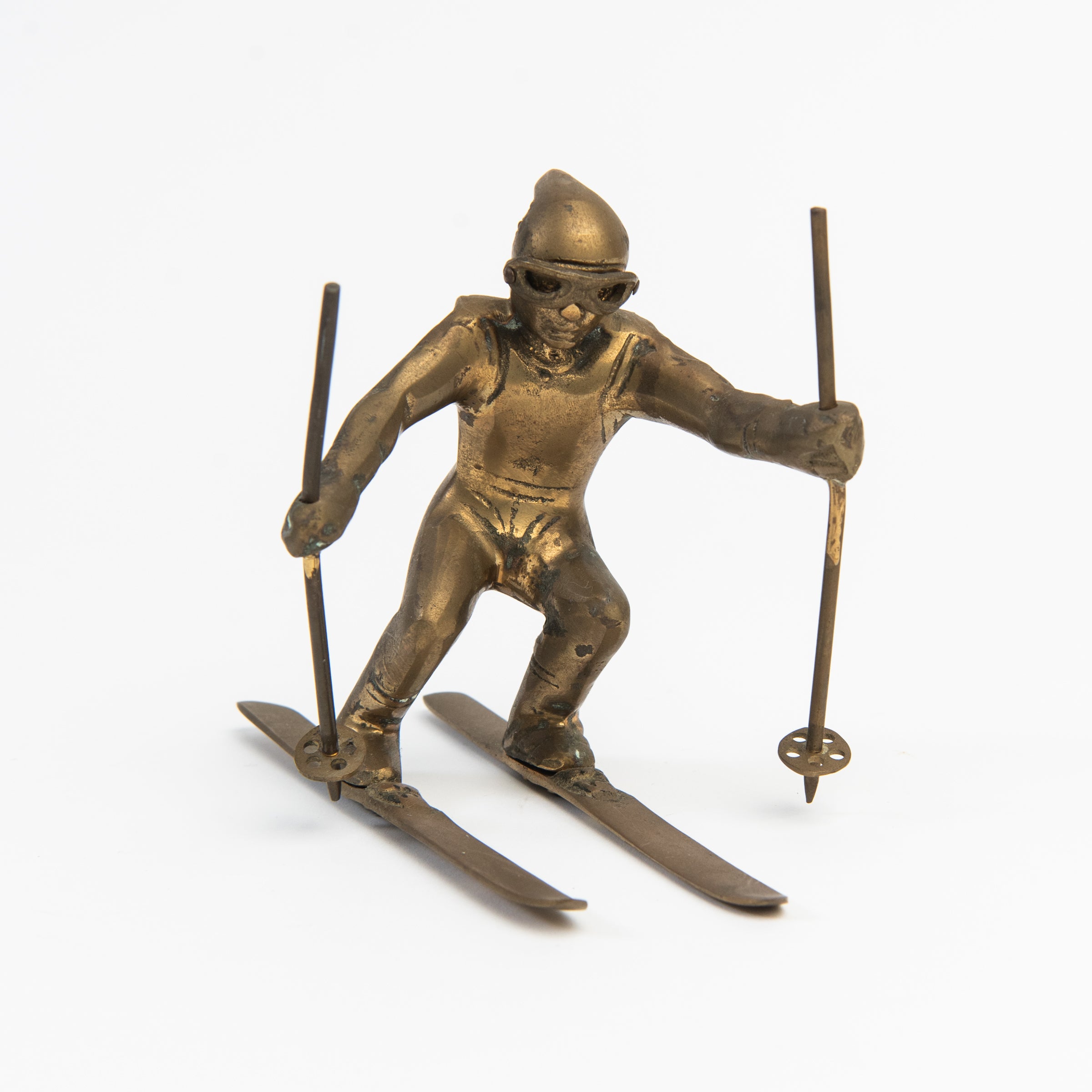 Vintage Brass Skier on a white background at Addison West